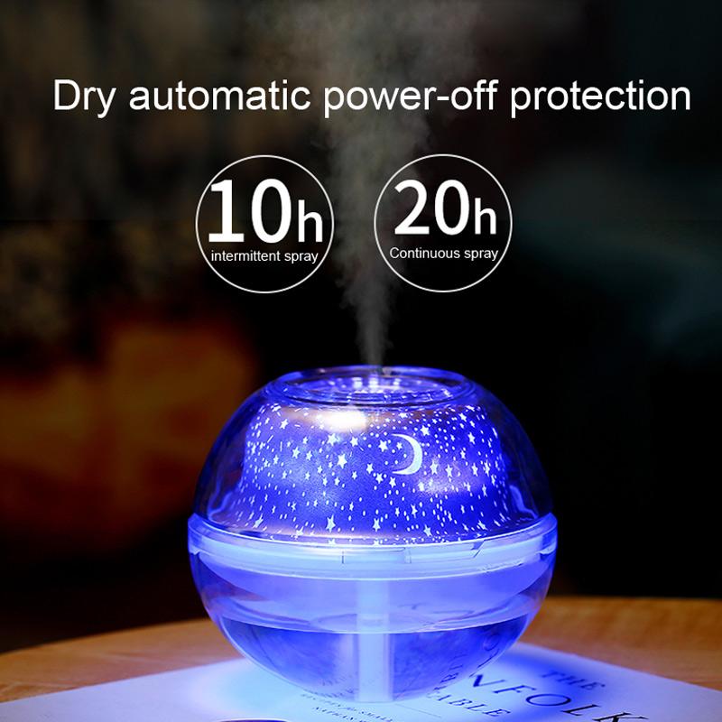 USB Crystal Night Lamp Projector with 500ml Air Humidifier, showcasing its sleek silver design and mist output.