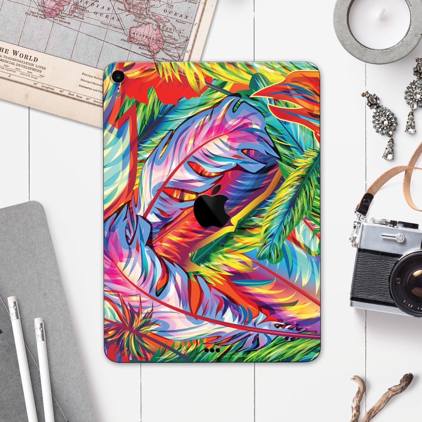 Vibrant colorful feathers skin decal for Apple iPad, showcasing intricate feather designs and premium finish.