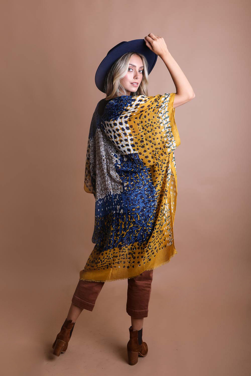 A vibrant multicolor frayed kimono showcasing a retro design, perfect for stylish layering.