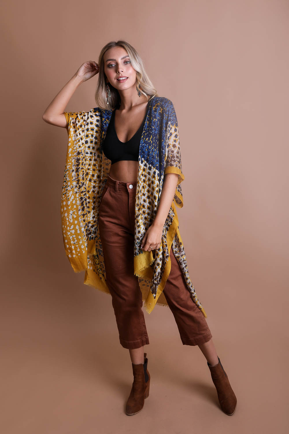 A vibrant multicolor frayed kimono showcasing a retro design, perfect for stylish layering.