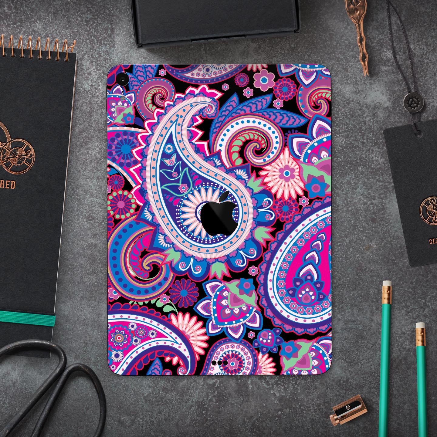 Vibrant Purple Paisley V5 skin decal for Apple iPad, showcasing intricate paisley design and premium finish.