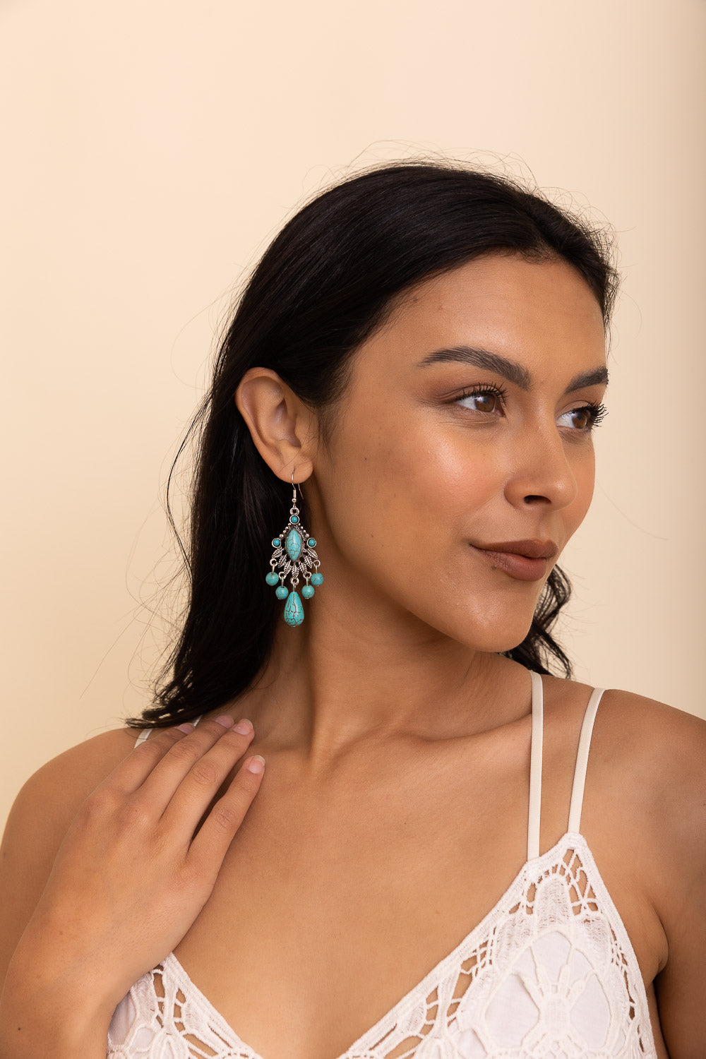Elegant Vintage Turquoise Silver Chandelier Earrings featuring a unique turquoise stone and intricate silver design.