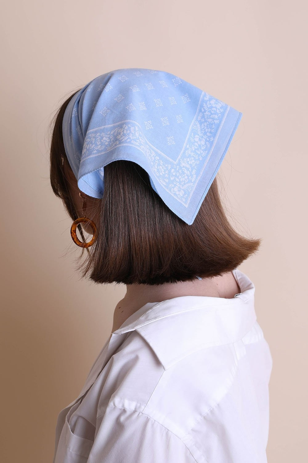 A stylish Vintage Western Bandana featuring a southwestern design, perfect for hair wraps, neck ties, or face masks, measuring 22.5 inches square.