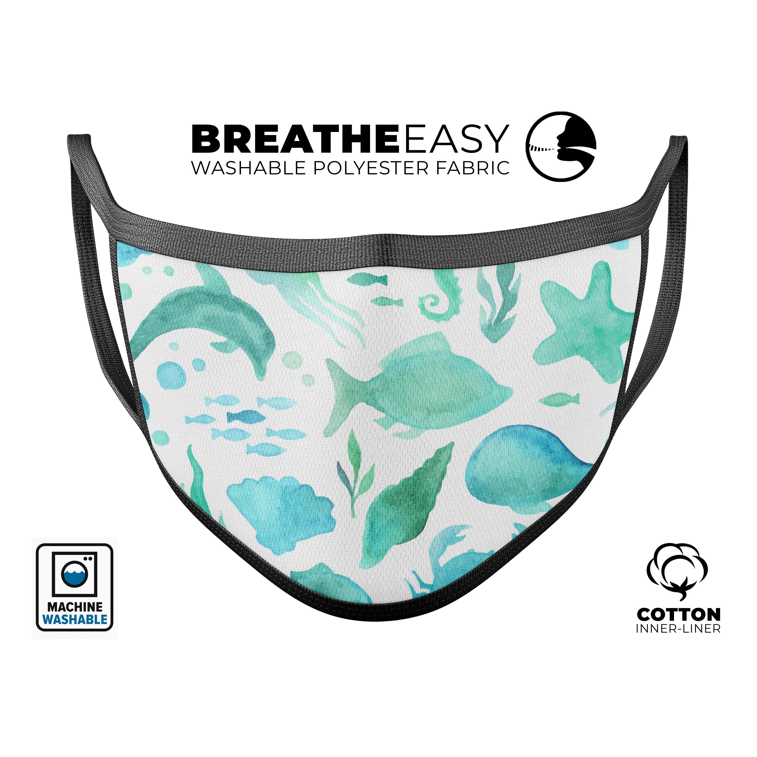 Vivid blue watercolor face mask featuring colorful sea creatures, adjustable ear loops, and a comfortable cotton interior.