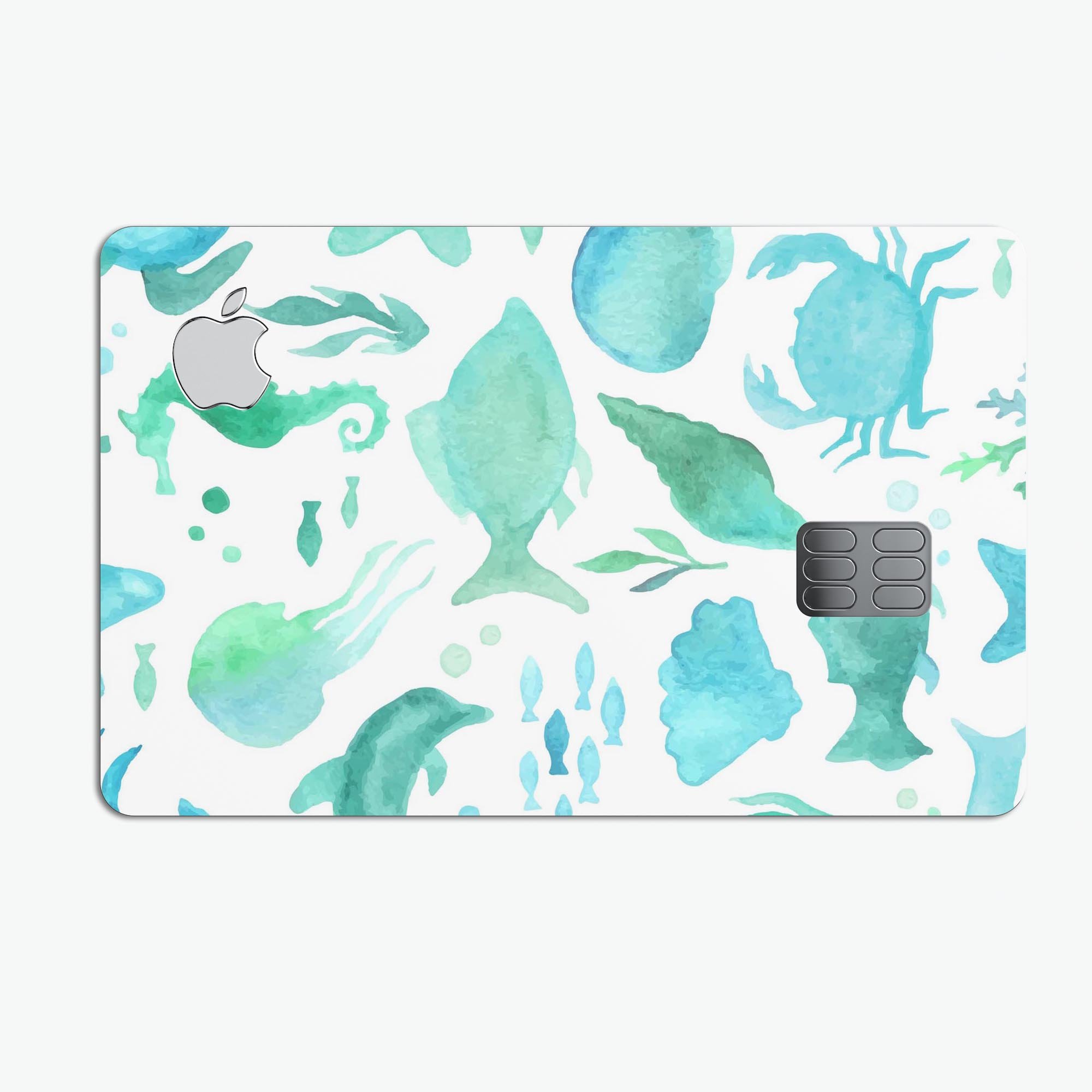 Vivid Blue Watercolor Sea Creatures decal on an Apple Card, showcasing vibrant colors and a protective design.