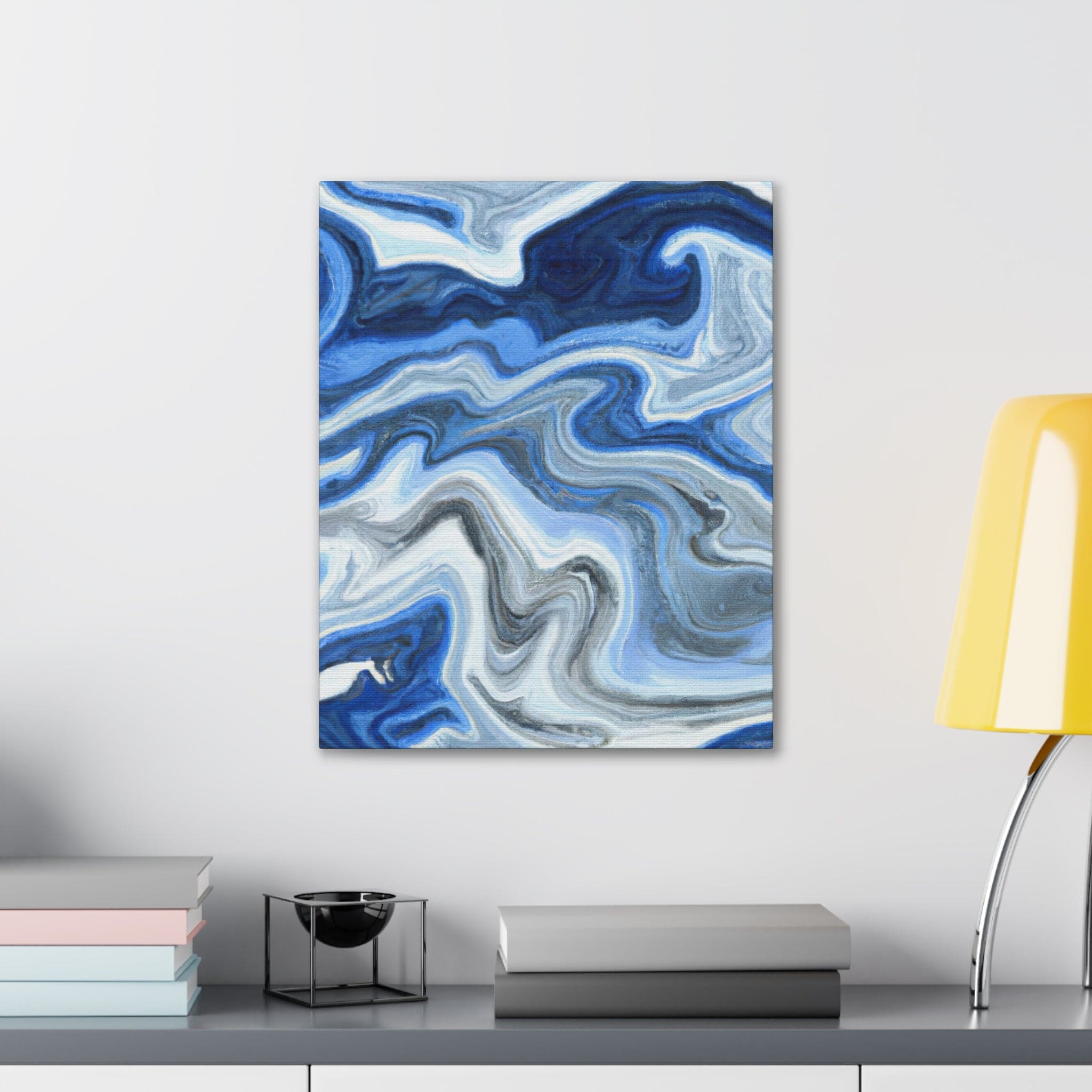 Canvas print artwork featuring a blue, white, and grey marble pattern, showcasing elegant swirls and textures.