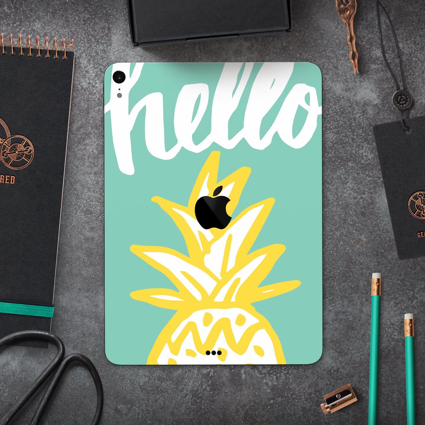 Well Hello Pineapple full body skin decal for Apple iPad Pro, featuring a vibrant pineapple design on a protective layer.