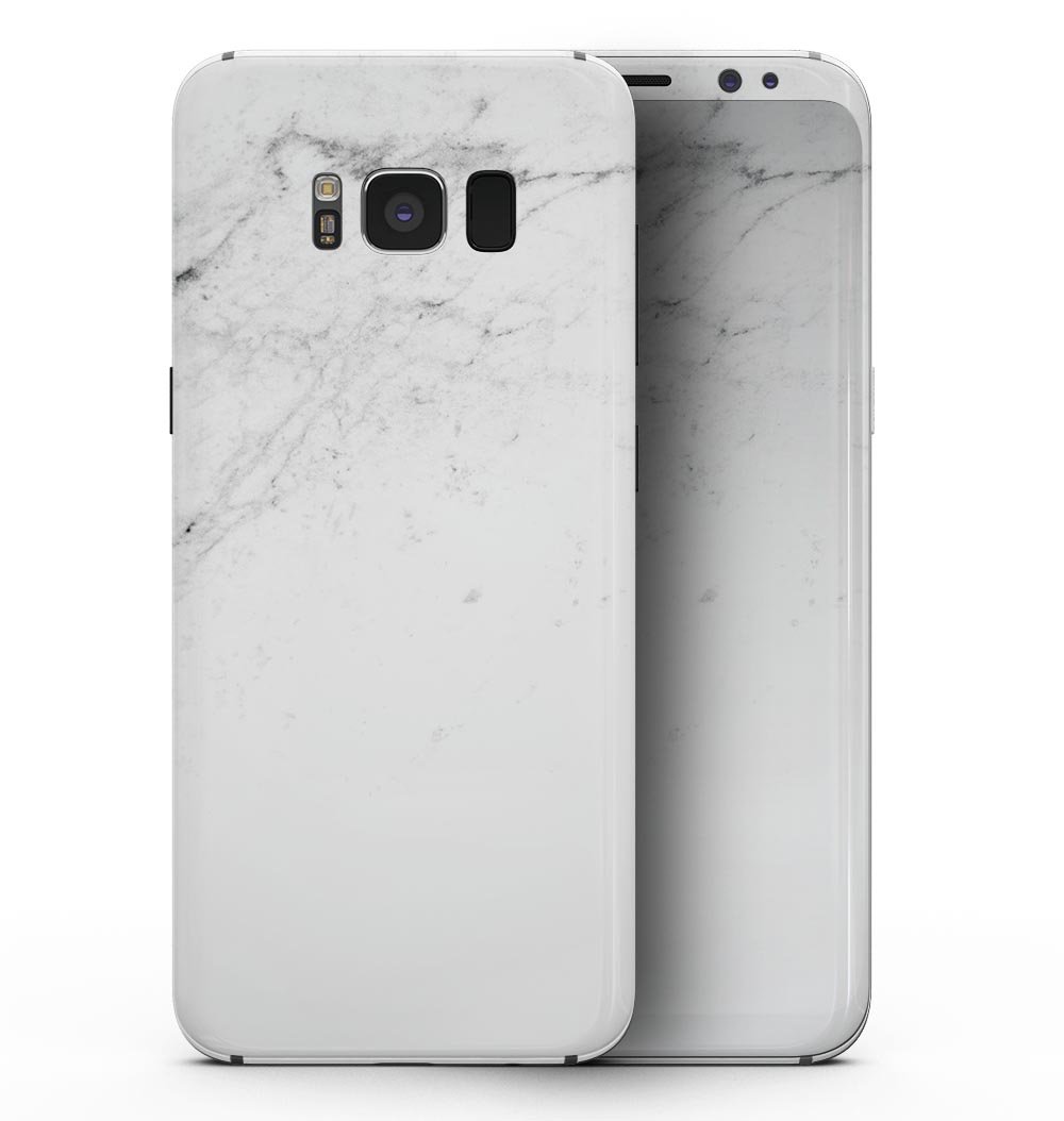 Samsung Galaxy S8 with a stylish white and black marble vinyl skin, showcasing its sleek design and premium finish.
