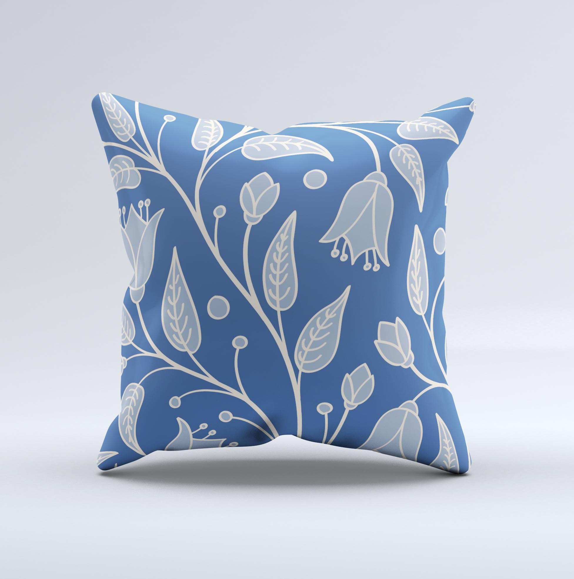 White and blue decorative throw pillow featuring vector branches design, handcrafted in Virginia.