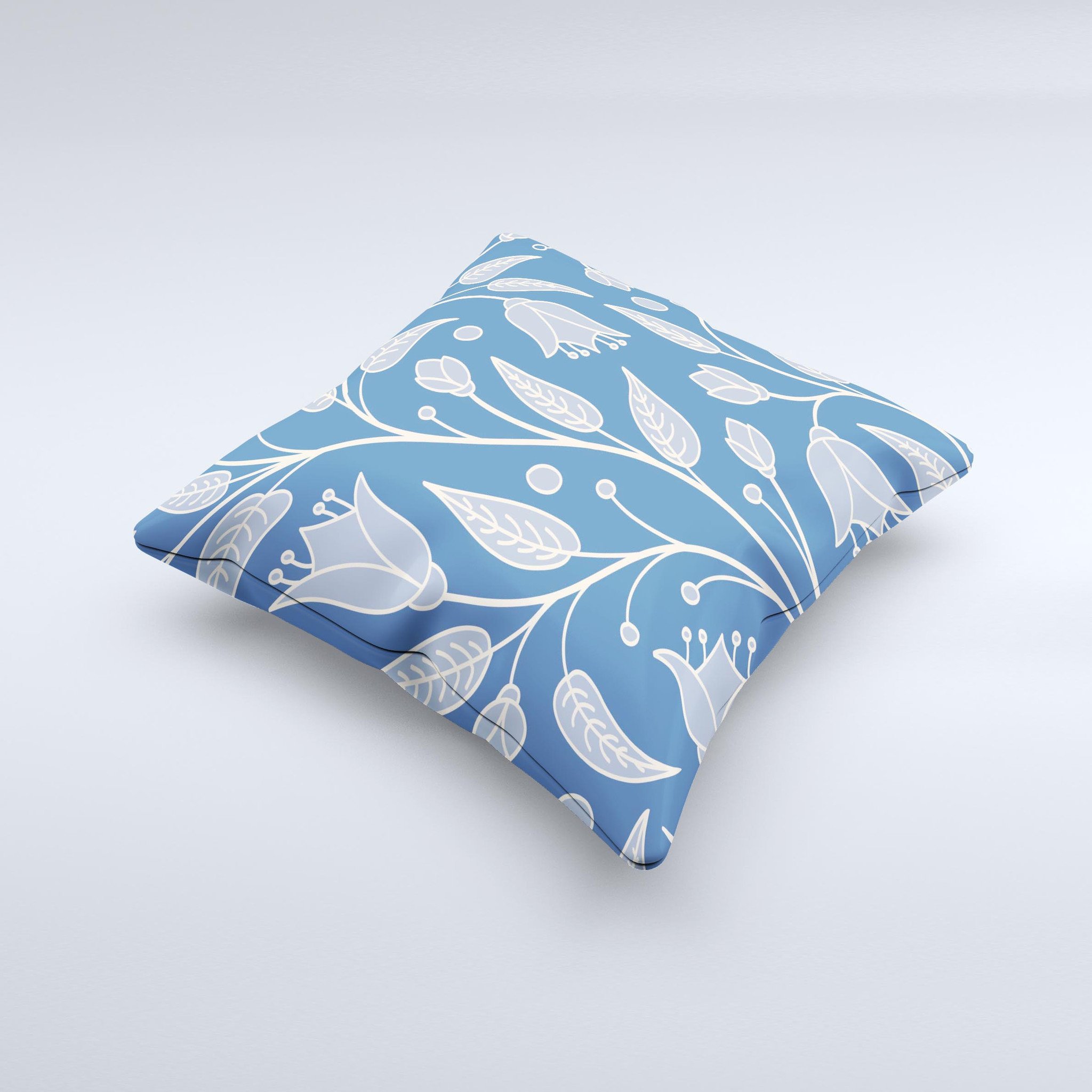 White and blue decorative throw pillow featuring vector branches design, handcrafted in Virginia.