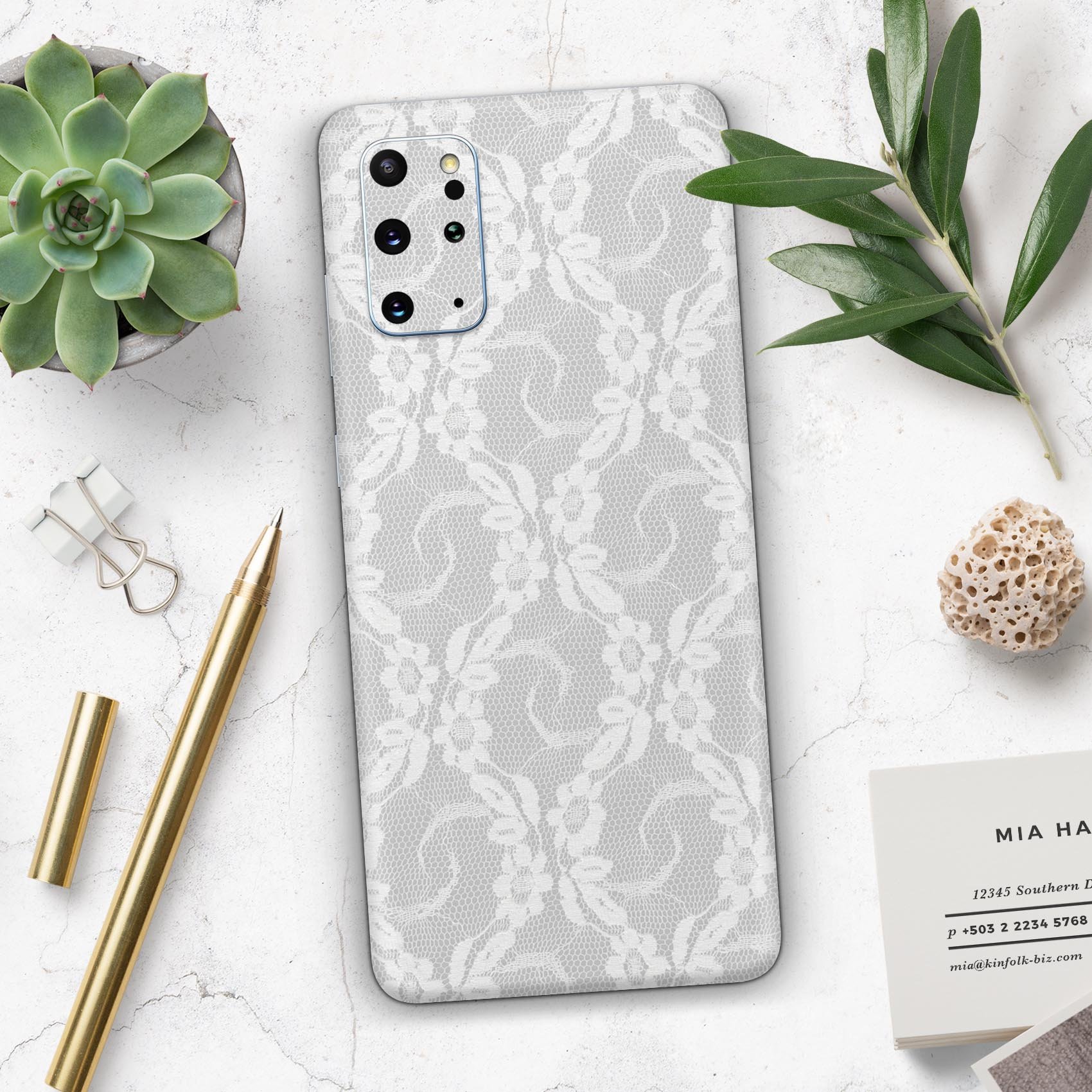 White Floral Lace Skin-Kit for Samsung Galaxy S20, showcasing a stylish floral design on a sleek vinyl surface.