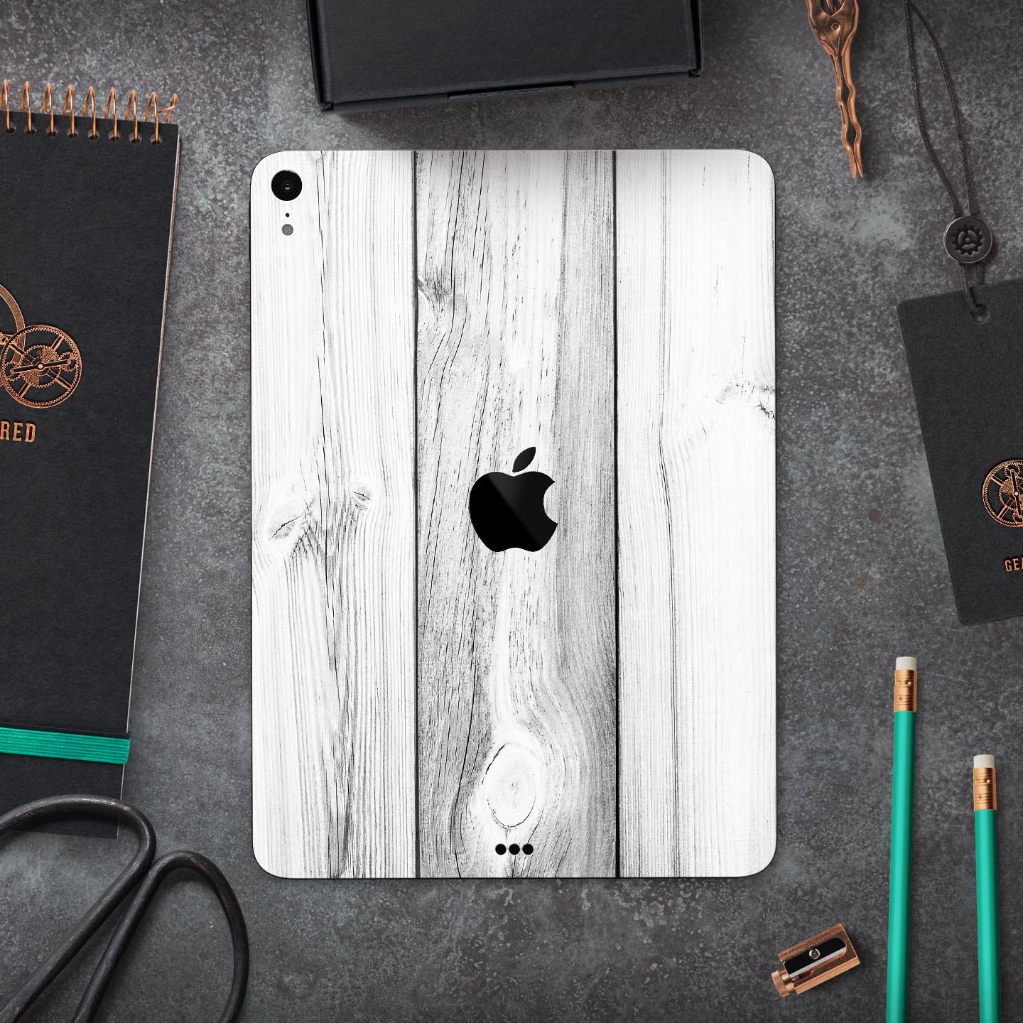 White and gray wood planks skin decal for Apple iPad Pro, showcasing a stylish and protective design.
