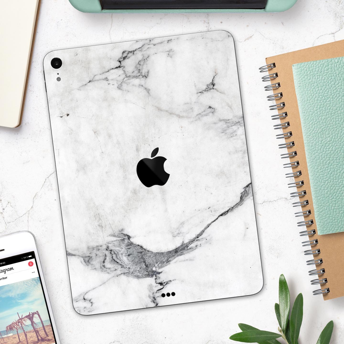 White and grey marble skin decal for Apple devices, showcasing a sleek and stylish design with a premium finish.