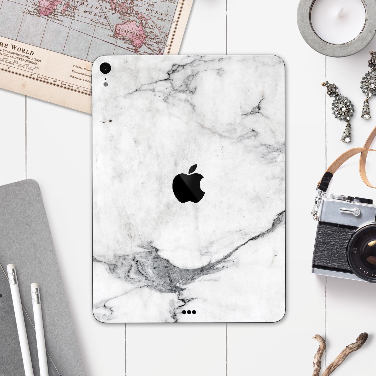 White and grey marble skin decal for Apple devices, showcasing a sleek and stylish design with a premium finish.