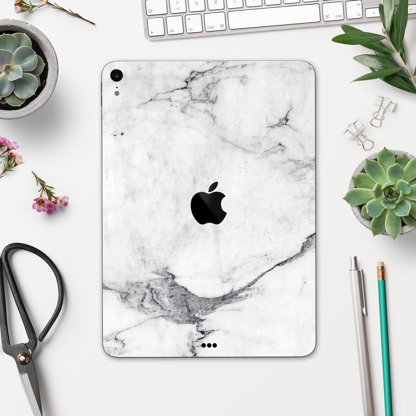 White and grey marble skin decal for Apple devices, showcasing a sleek and stylish design with a premium finish.