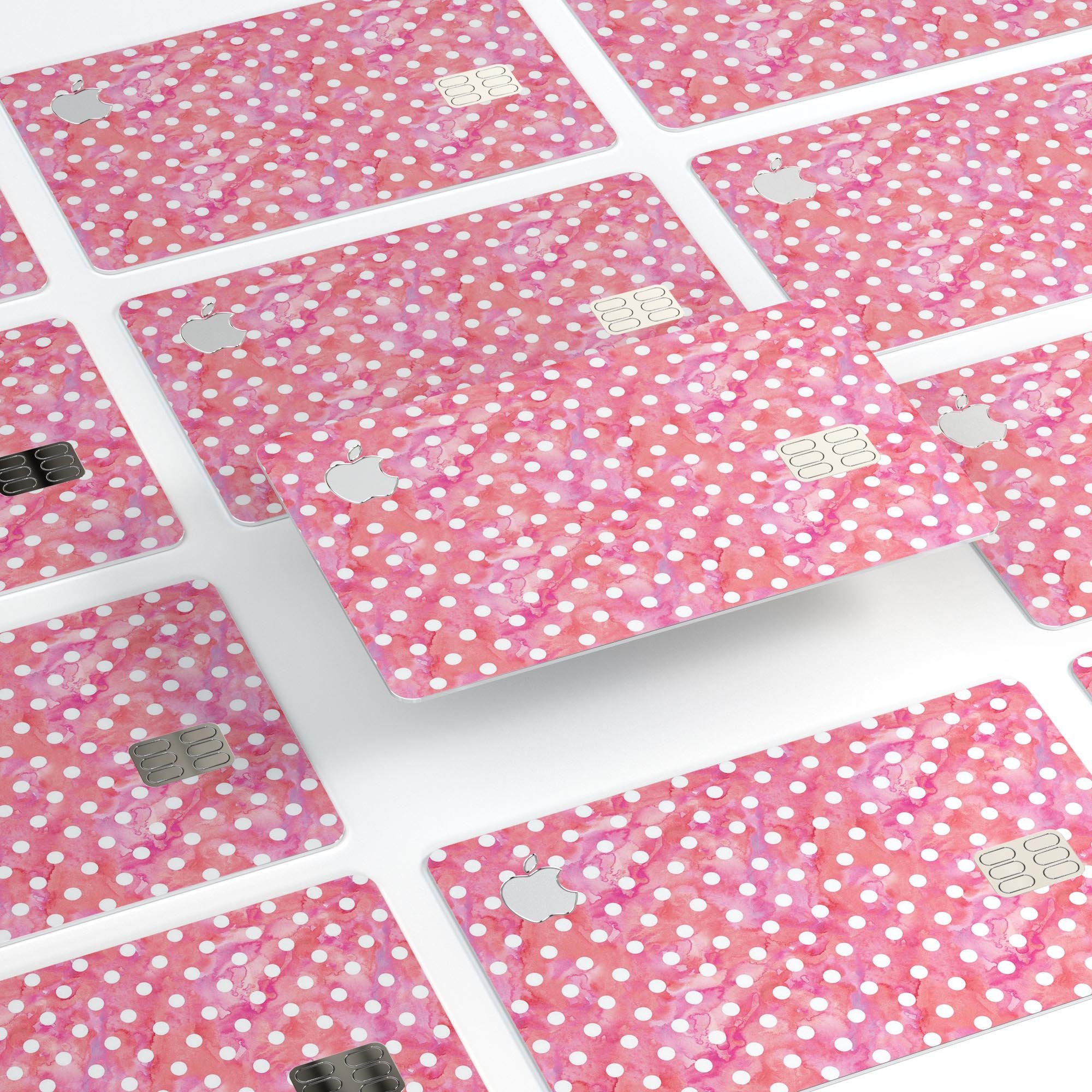 White polka dots on a pink watercolor background, showcasing a premium protective decal for the Apple Card.
