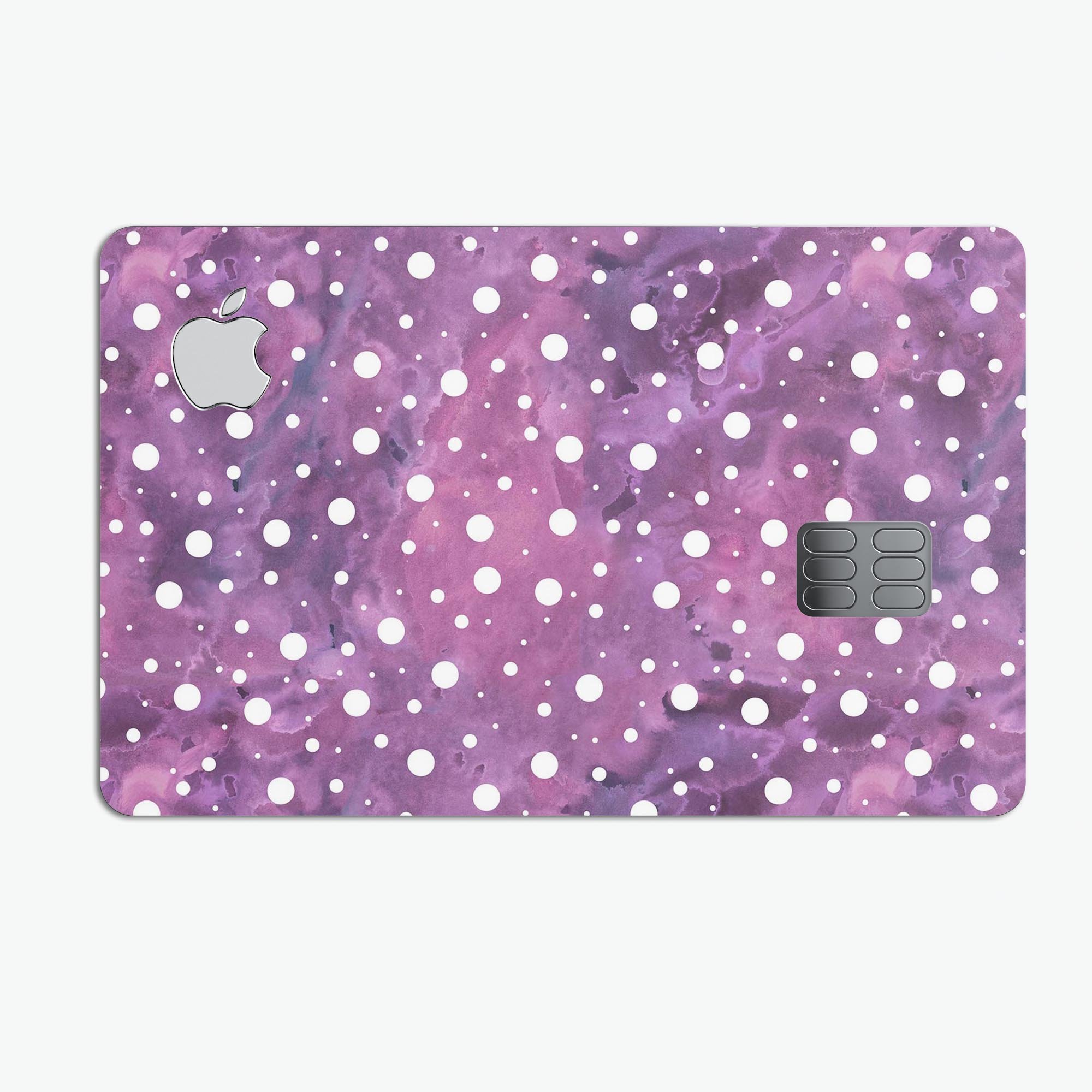 White polka dots over a vibrant purple and pink paint mix on a premium protective decal for Apple Card.
