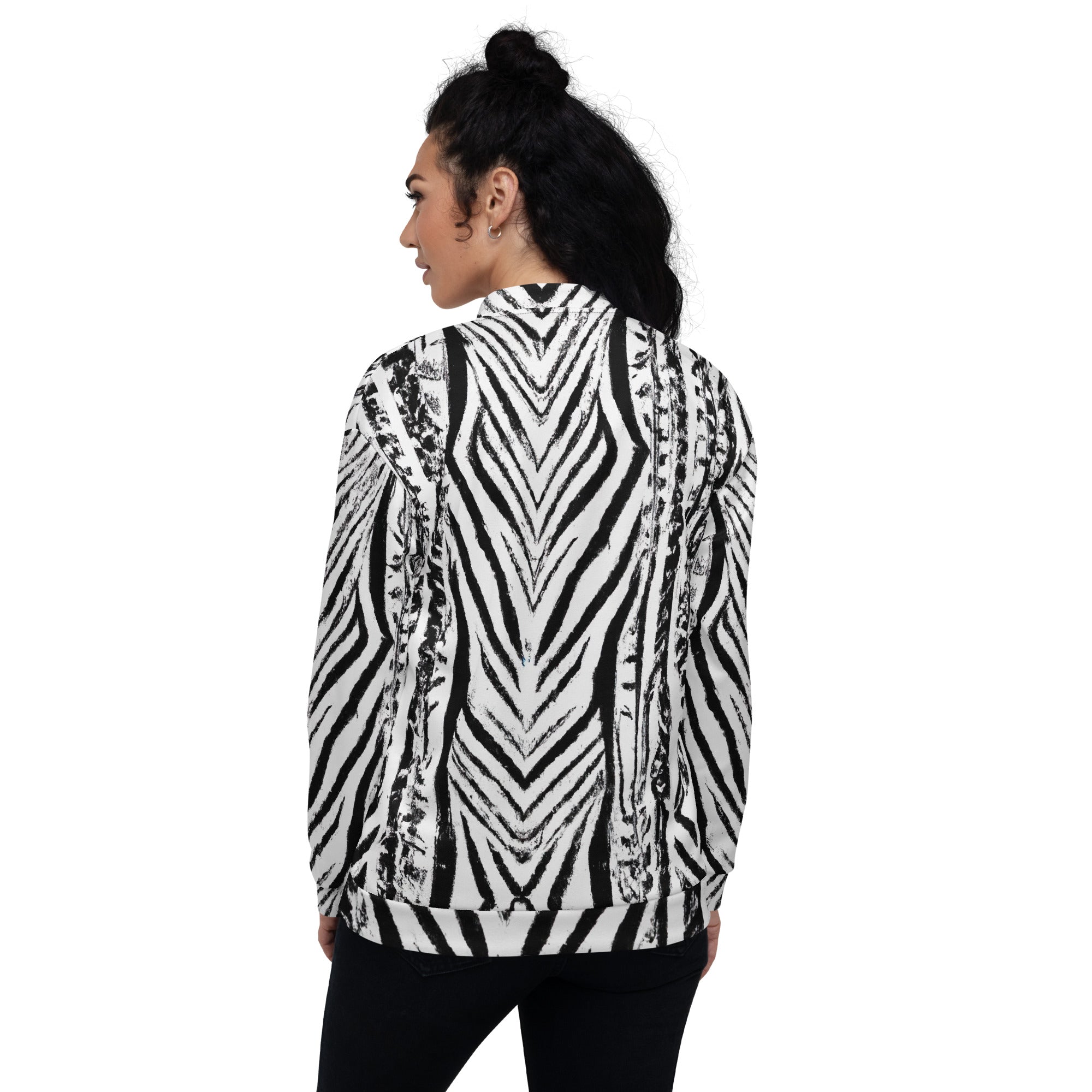 Women's bomber jacket featuring a black and white native print, zip-front closure, and ribbed cuffs, ideal for stylish layering.