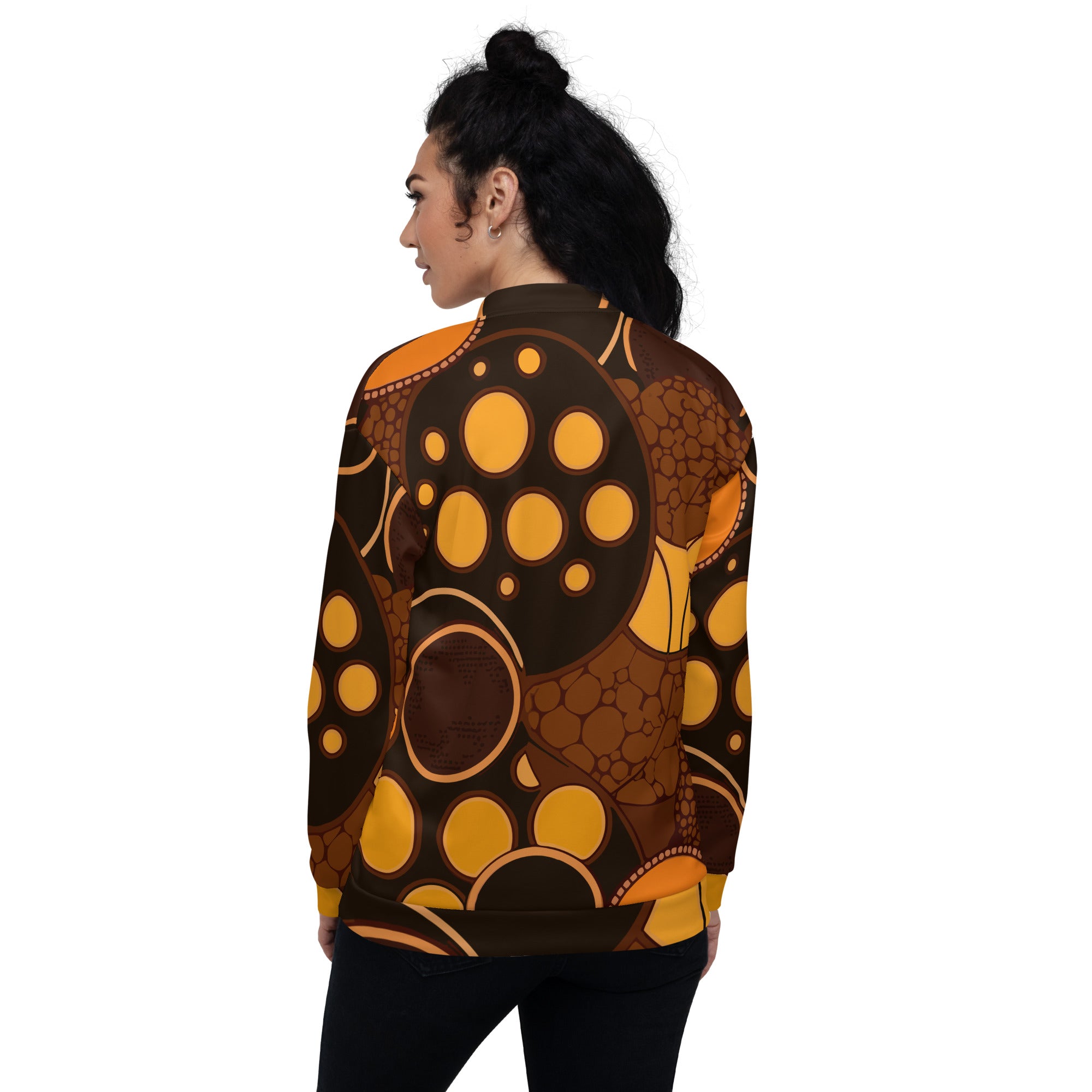 Women's bomber jacket featuring an orange and brown spotted print, zip-front closure, and ribbed cuffs, perfect for stylish layering.