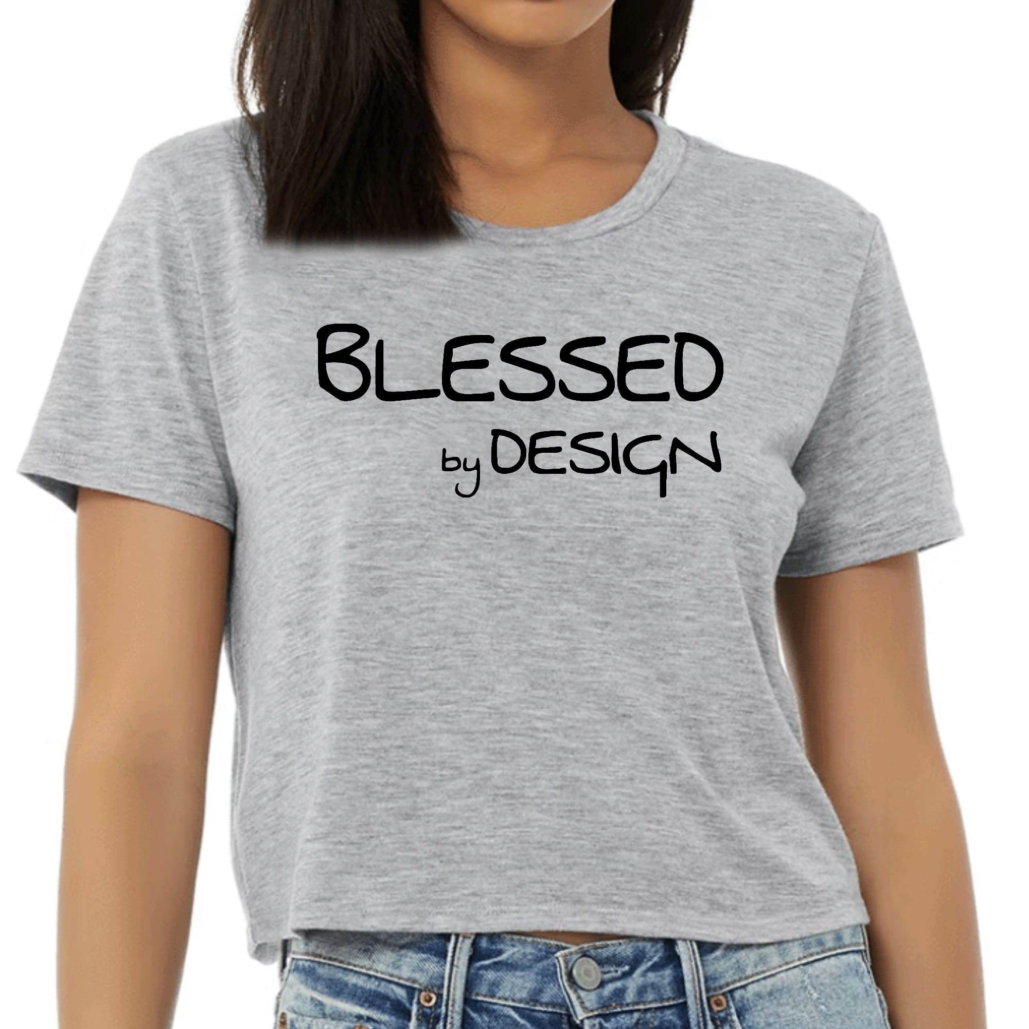 Womens Cropped Graphic T-shirt in black featuring the phrase 'Blessed by Design' in an inspirational graphic print.