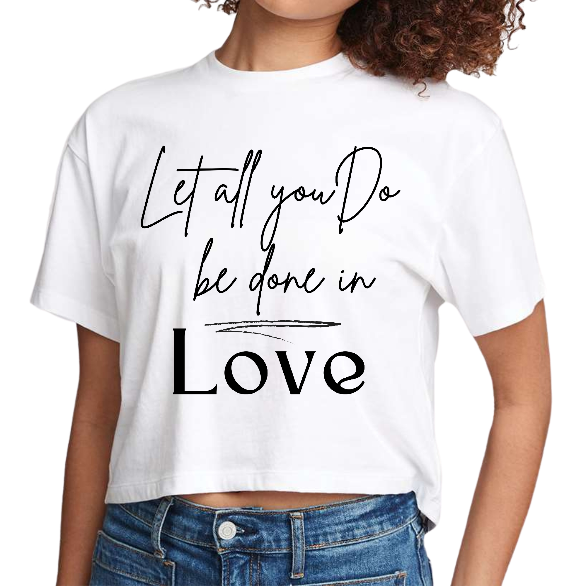 Women's cropped graphic t-shirt in black featuring the quote 'Let All You Do Be Done in Love' printed on the front.