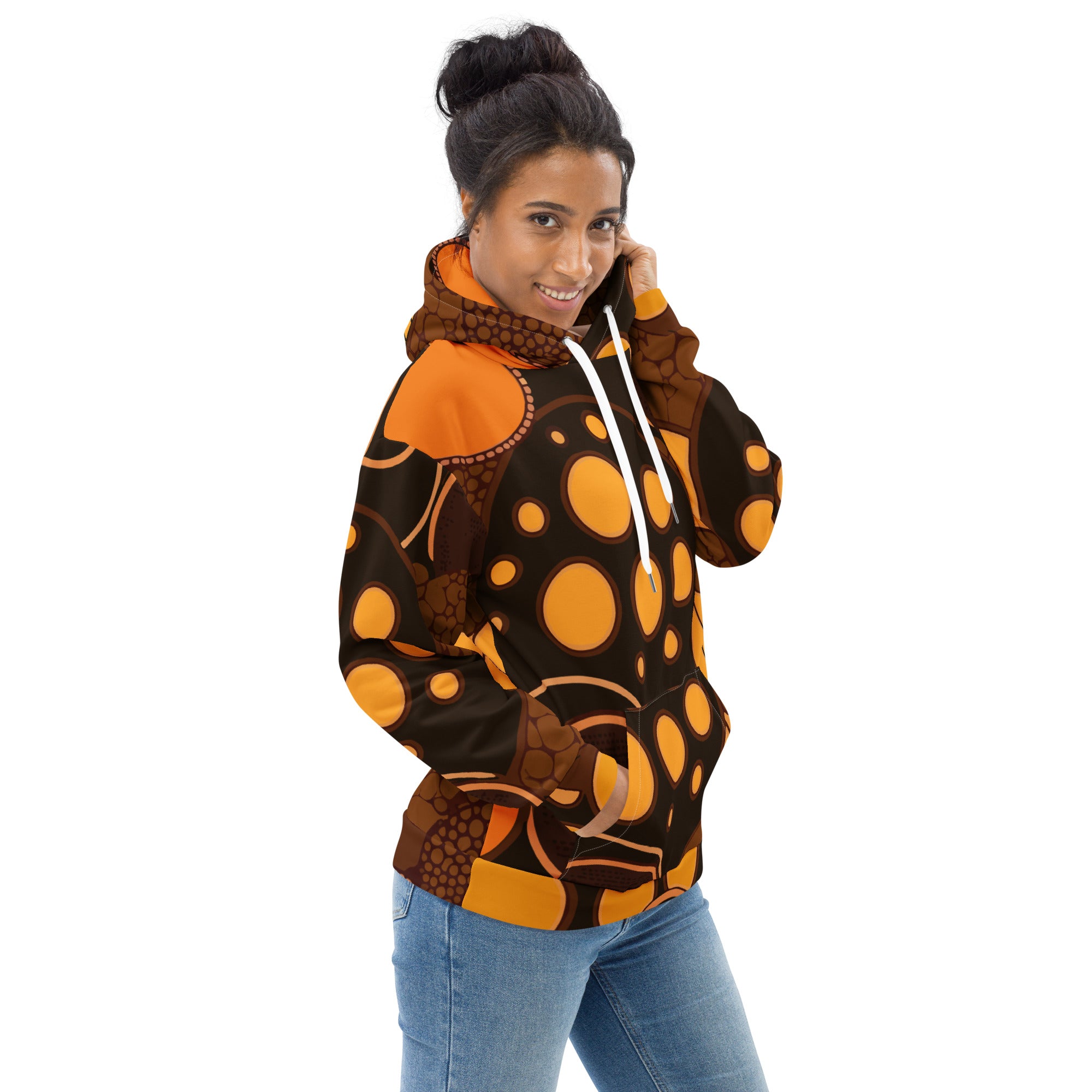Women's graphic hoodie featuring an orange and brown spotted print, designed for comfort and style with a double-lined hood and front pouch pocket.