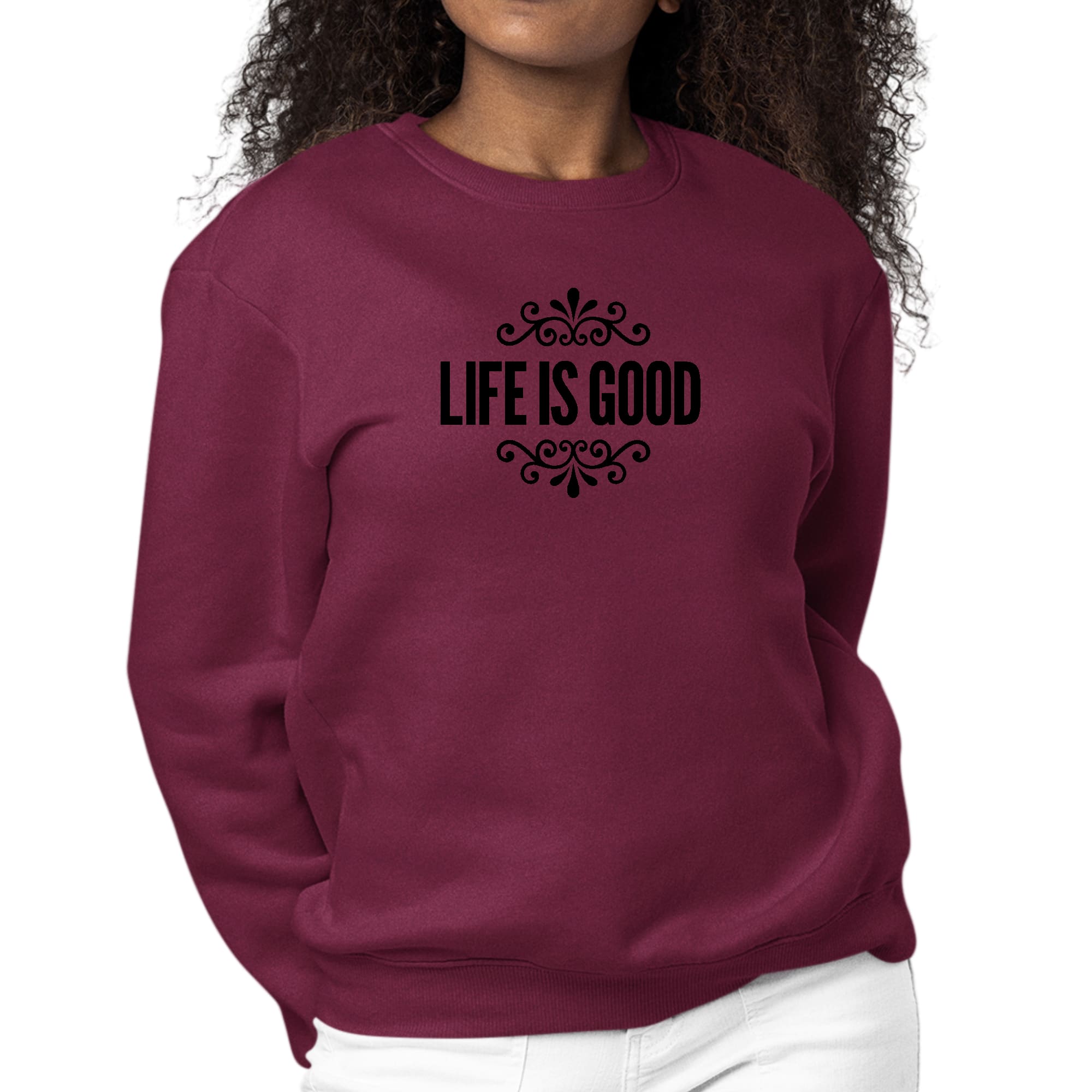 Women's black graphic sweatshirt with 'Life is Good' word art illustration, featuring long sleeves and a comfortable crewneck design.