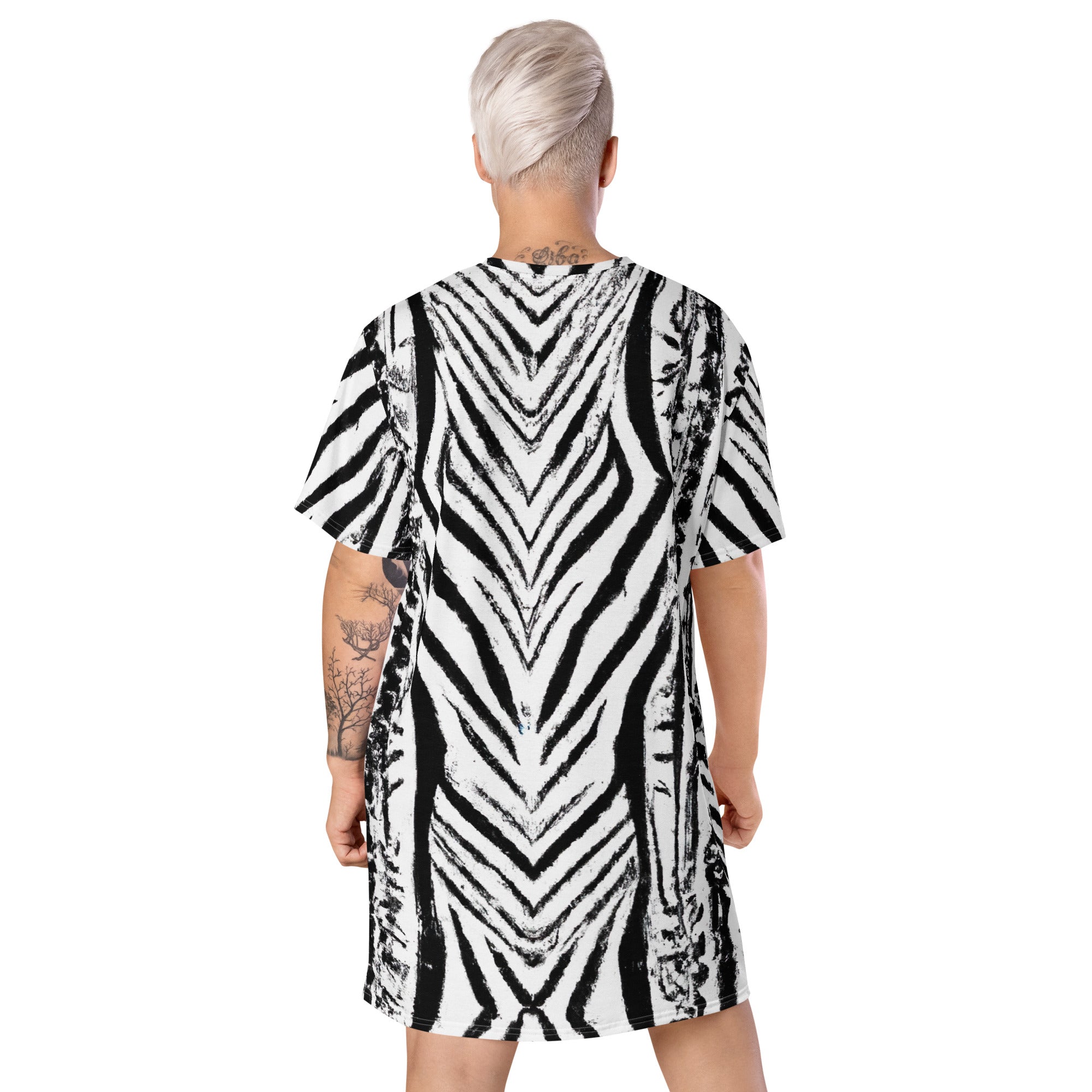 Womens Graphic T-shirt Dress featuring a black and white native print, showcasing its oversized fit and stylish design.