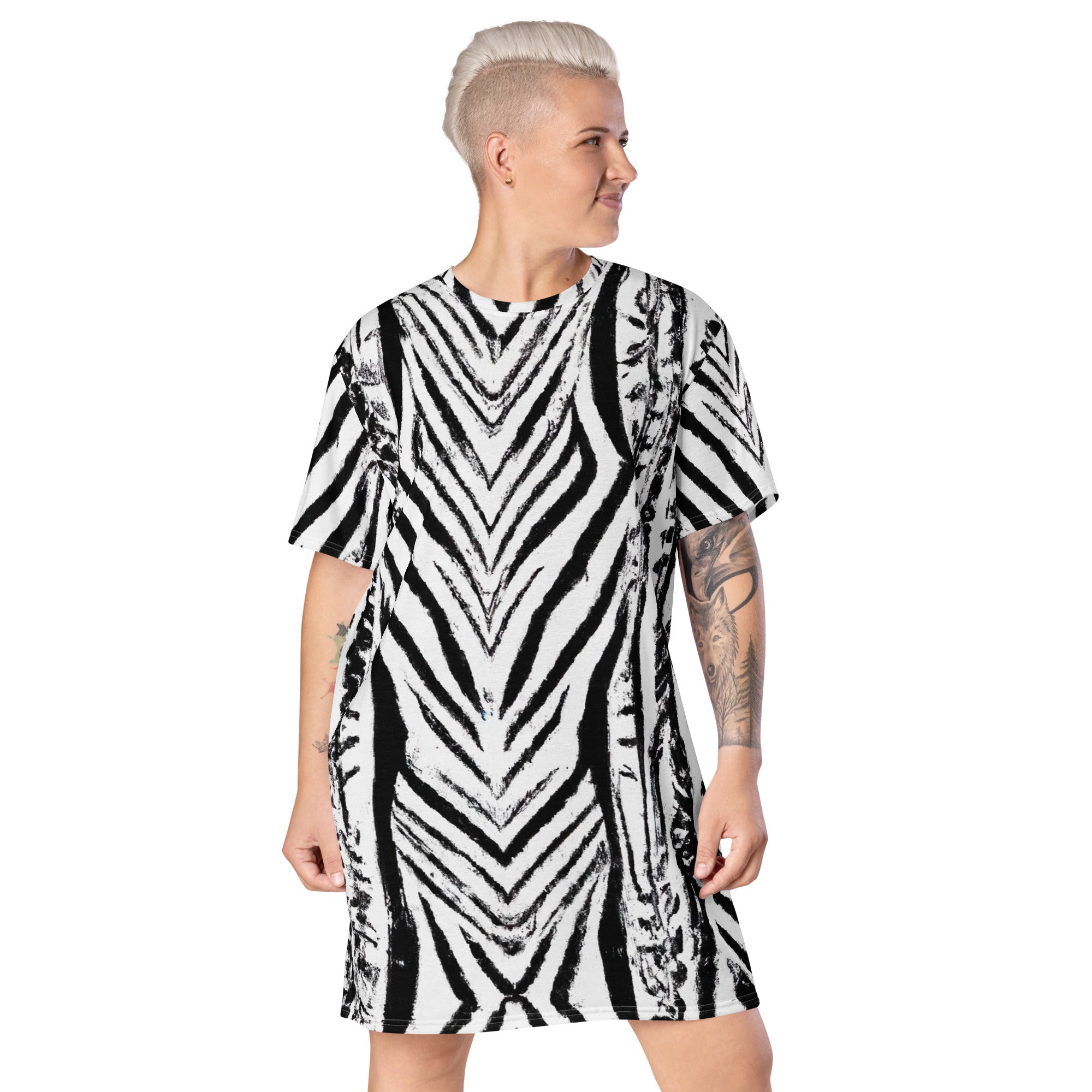Womens Graphic T-shirt Dress featuring a black and white native print, showcasing its oversized fit and stylish design.