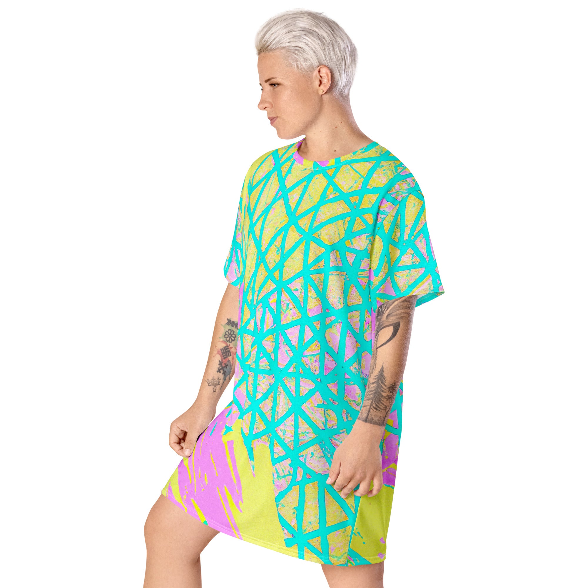 Womens Graphic T-shirt Dress featuring a vibrant cyan blue, lime green, and pink pattern, showcasing its comfortable oversize fit and stylish design.