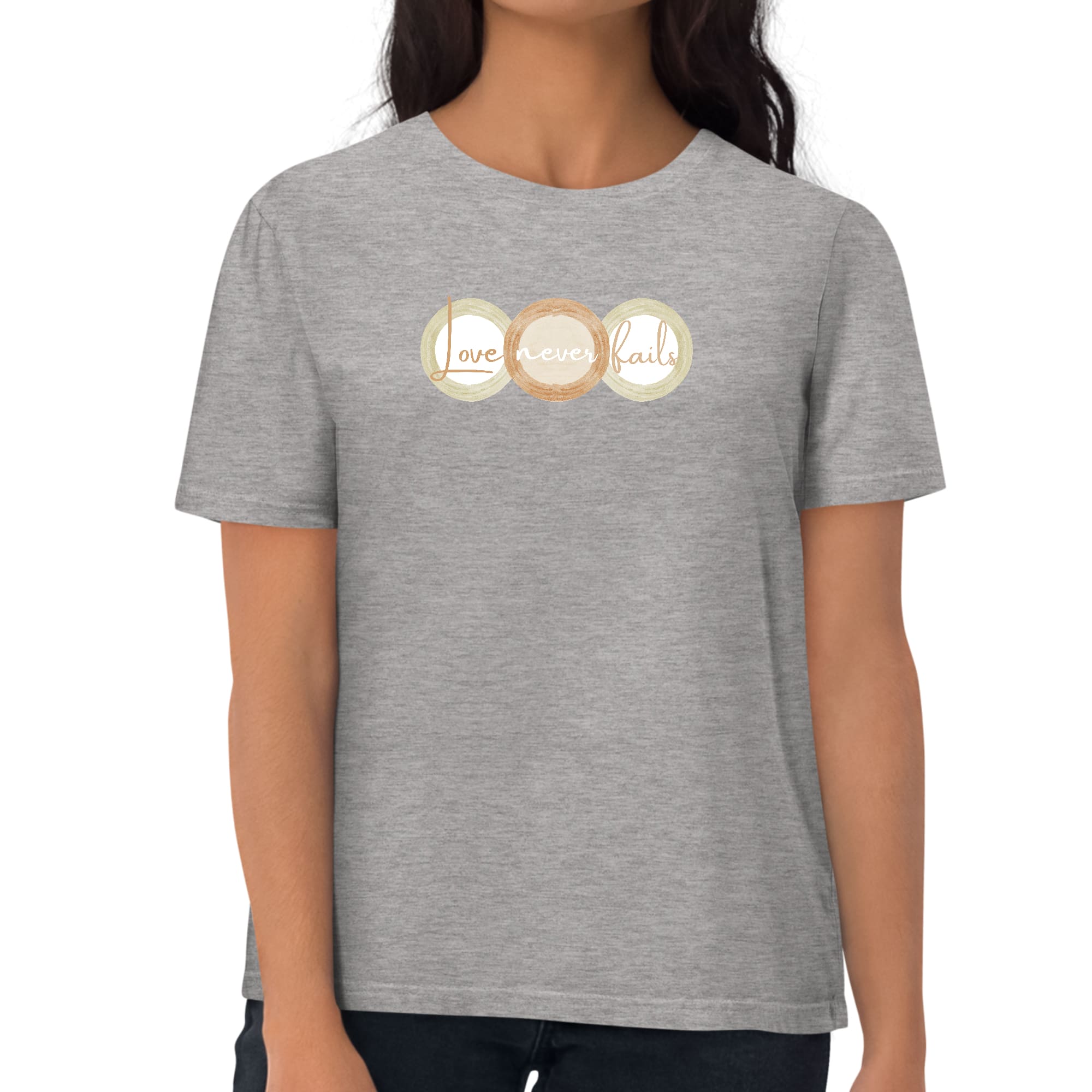 Womens Graphic T-shirt in pastel brown, beige, and green with 'Love Never Fails' design, showcasing a comfortable fit and stylish look.