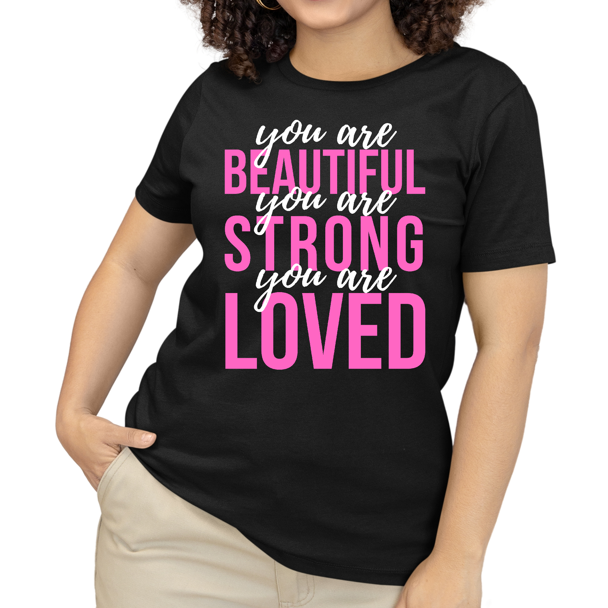 A pink and white women's graphic T-shirt with the inspirational text 'You Are Beautiful Strong Loved' printed on it, showcasing a comfortable and stylish design.