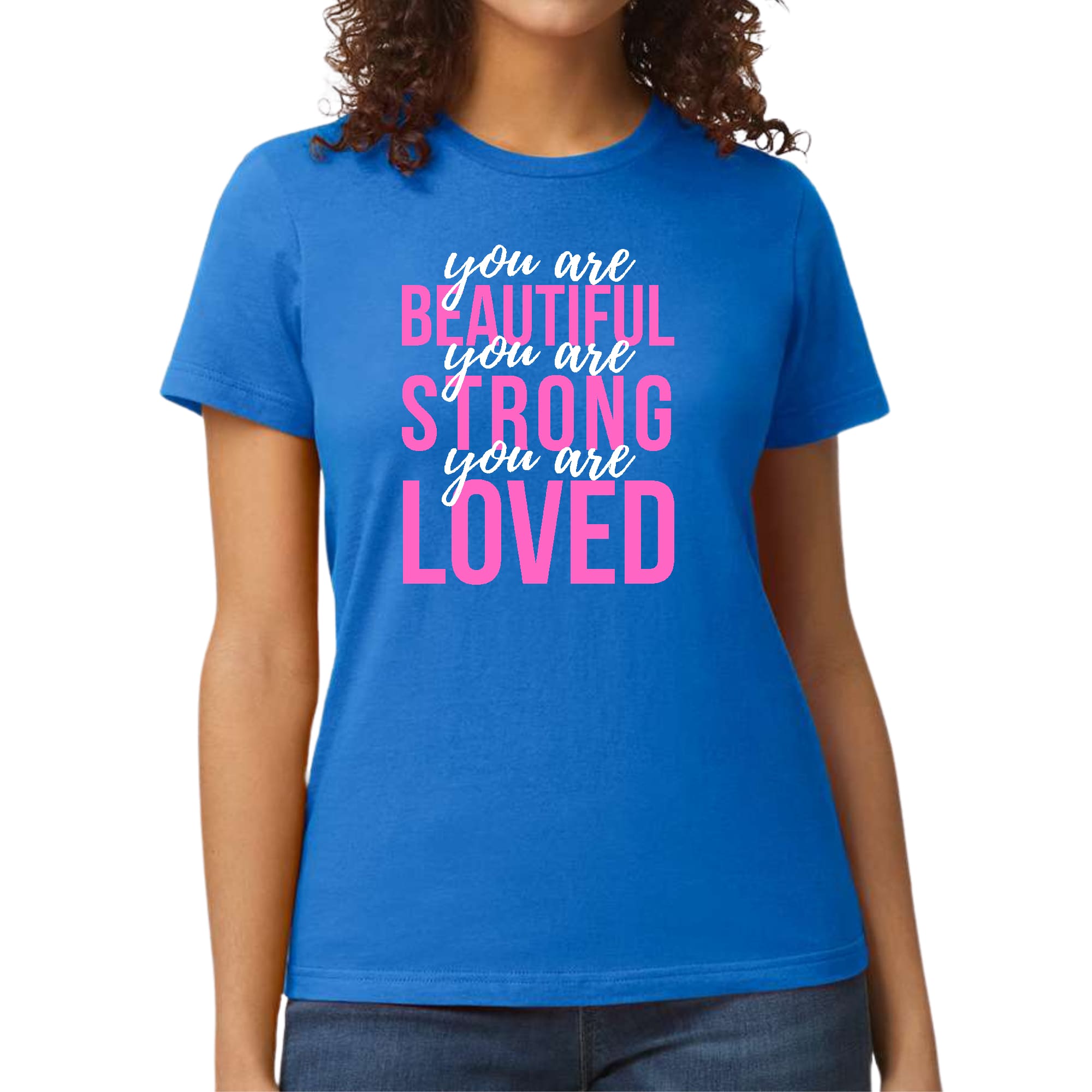 A pink and white women's graphic T-shirt with the inspirational text 'You Are Beautiful Strong Loved' printed on it, showcasing a comfortable and stylish design.