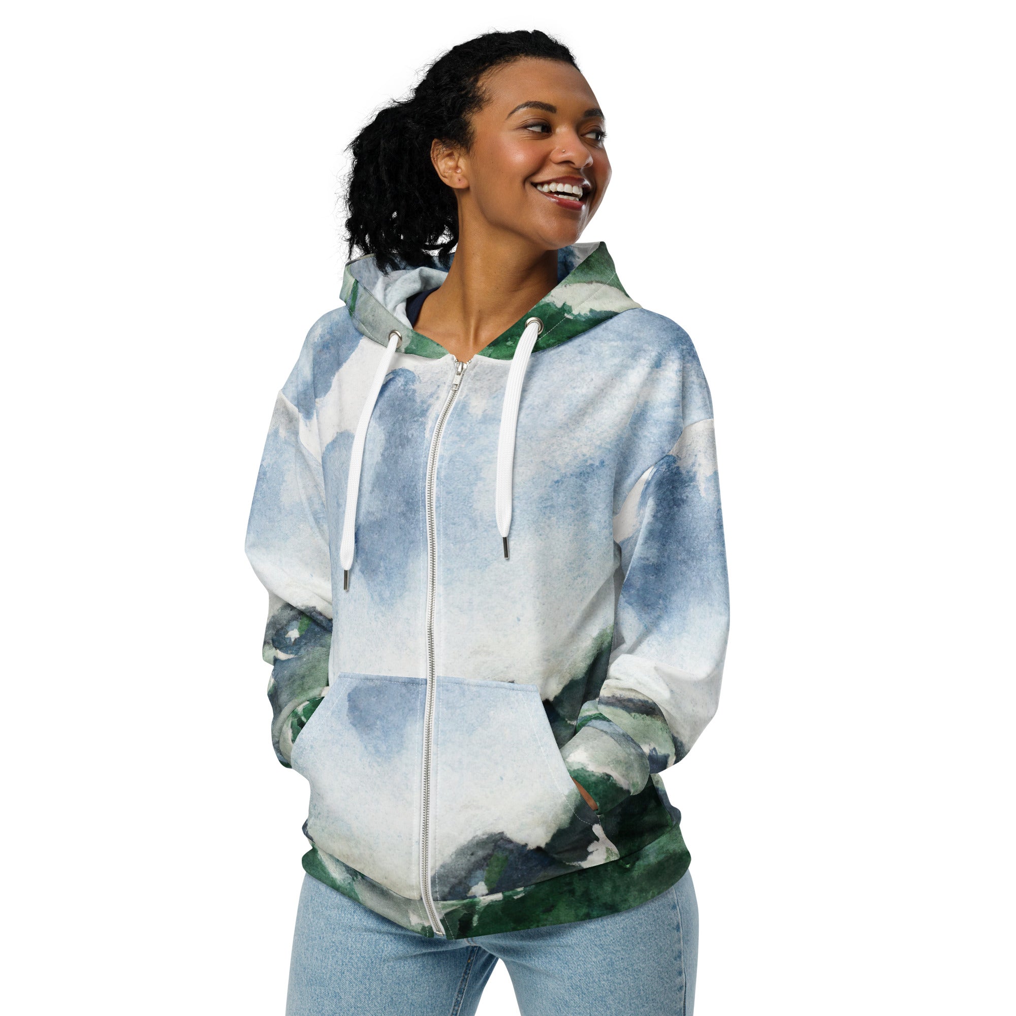 Womens Graphic Zip Hoodie showcasing a green mountainside landscape against a blue sky, featuring a relaxed fit and stylish design.