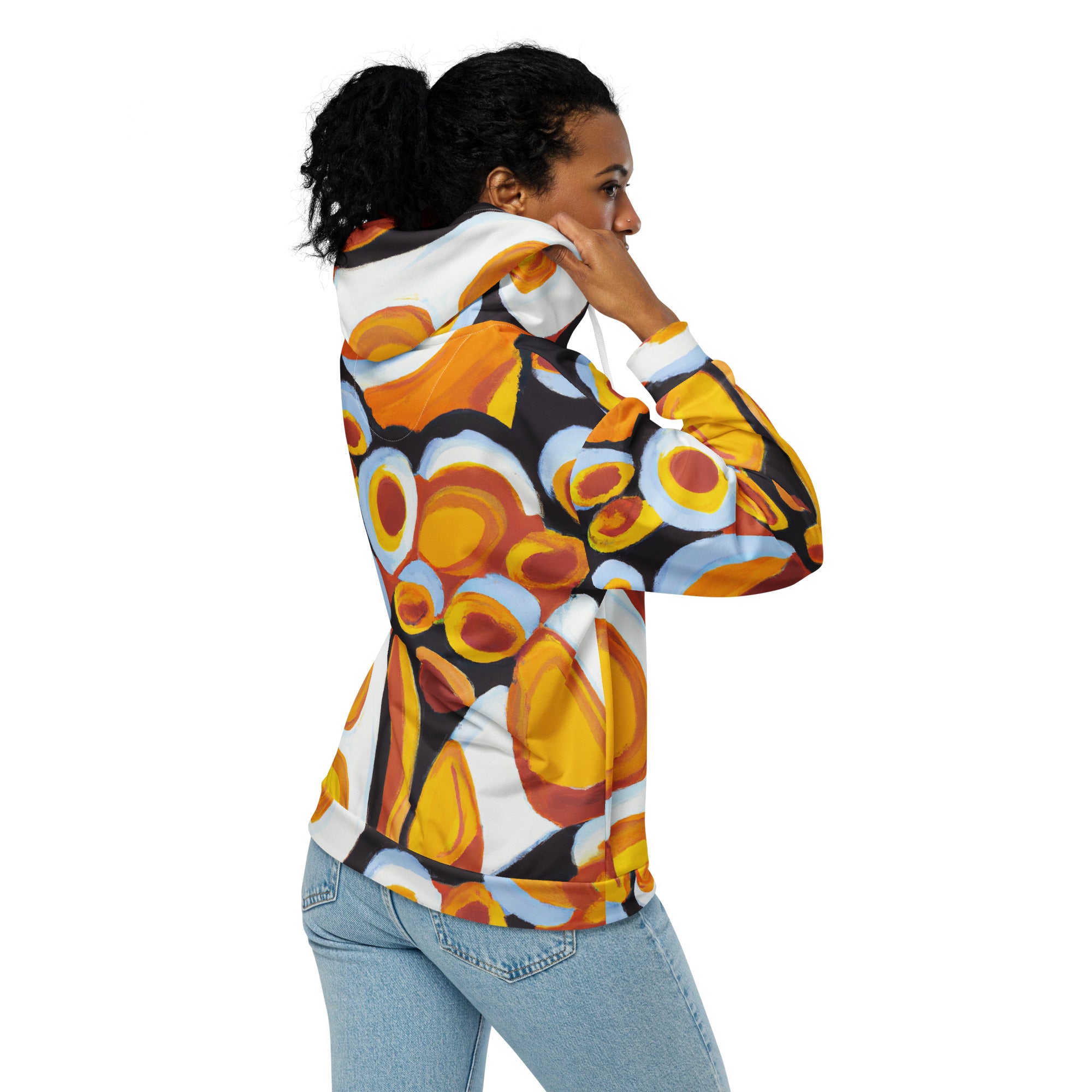 Women's Graphic Zip Hoodie featuring an orange, black, and white geometric print pattern, showcasing a relaxed fit and double-lined hood.