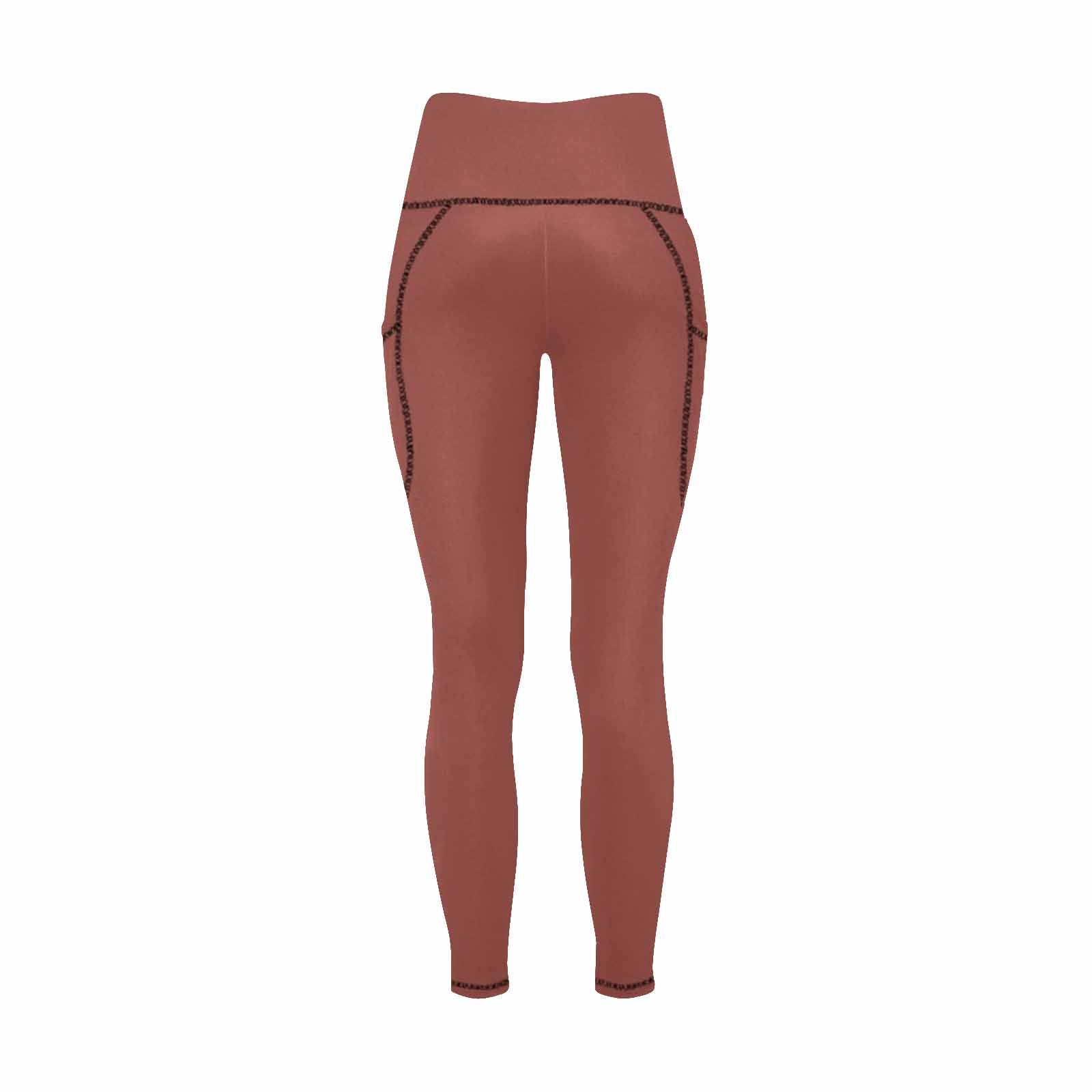A pair of women's cognac red leggings with side pockets, showcasing a stylish design and lightweight fabric, perfect for fitness and casual wear.