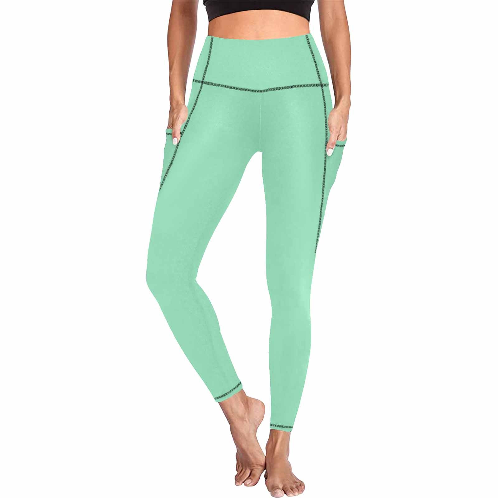 A pair of seafoam green women's leggings with pockets, showcasing a soft and lightweight fabric, perfect for fitness and casual wear.