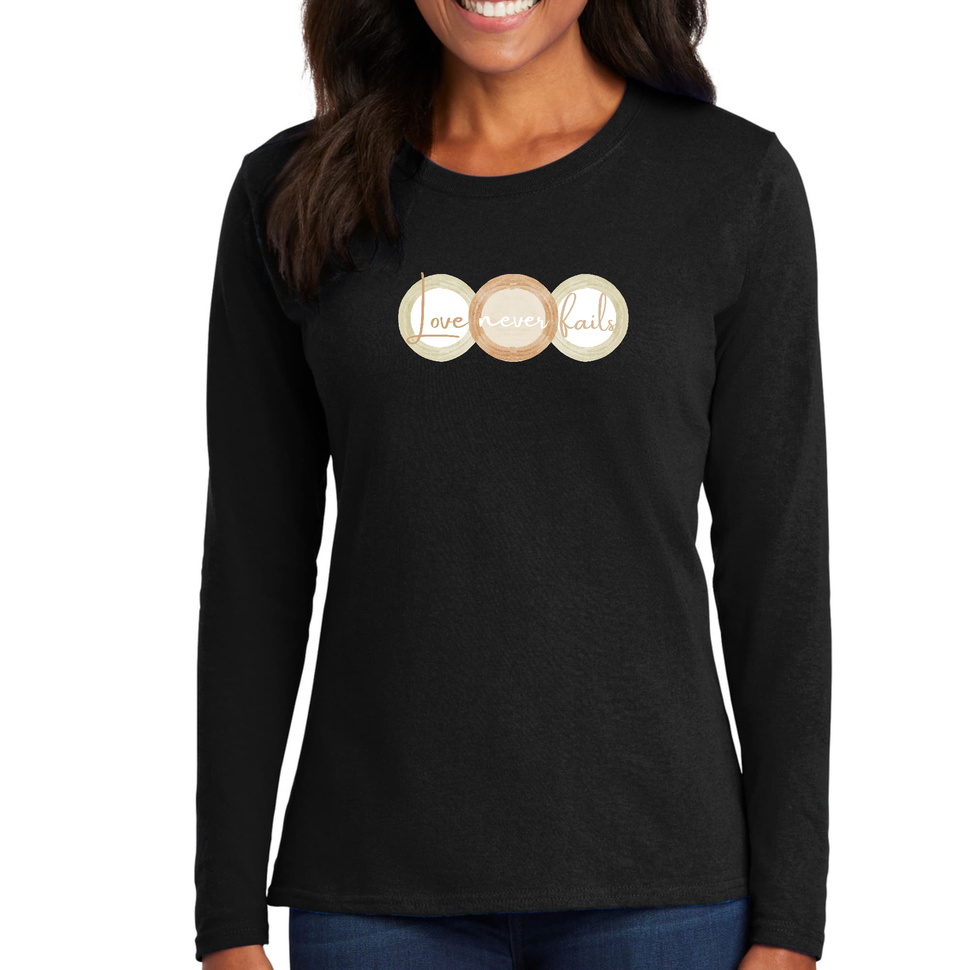 Womens Long Sleeve Graphic T-shirt in pastel brown featuring 'Love Never Fails' design with circular shapes in beige and green.