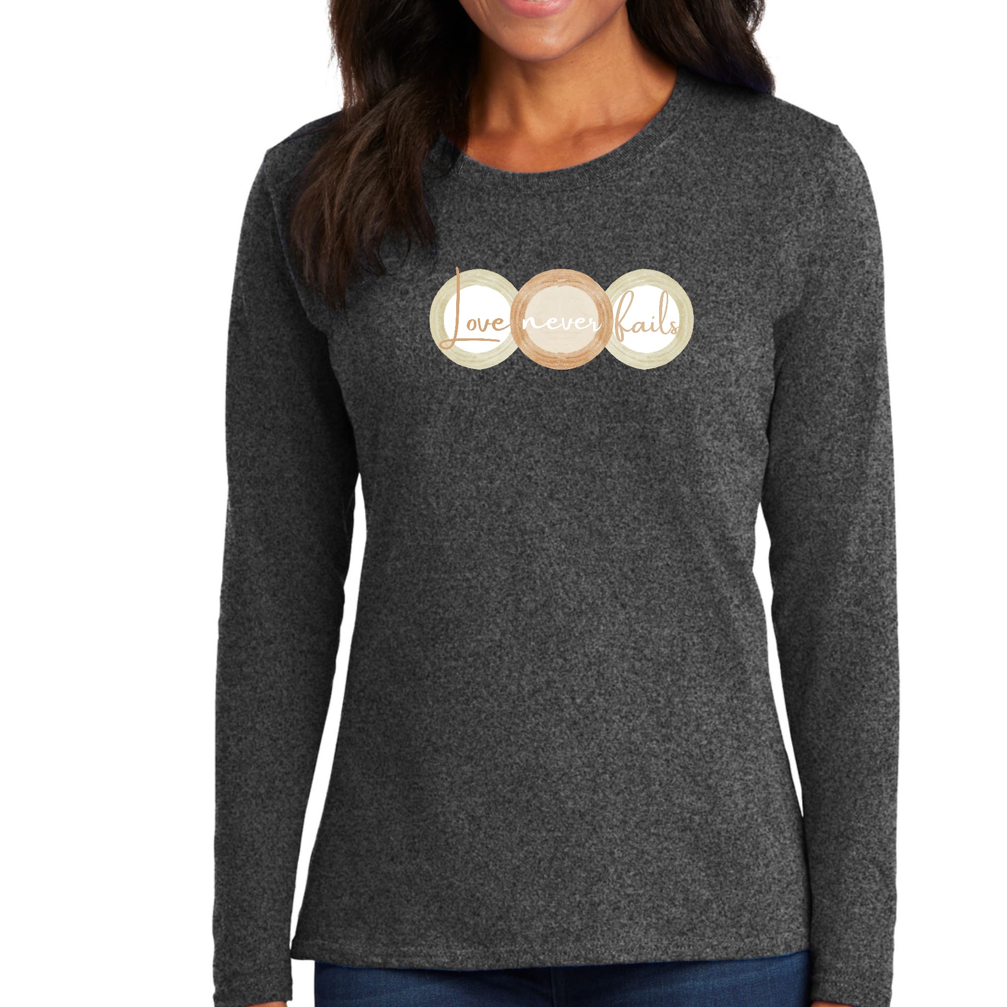 Womens Long Sleeve Graphic T-shirt in pastel brown featuring 'Love Never Fails' design with circular shapes in beige and green.
