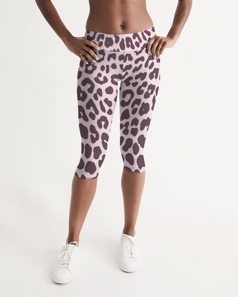 Women's Mid-rise Capri featuring a vibrant pink and black leopard print design, perfect for workouts and lounging.
