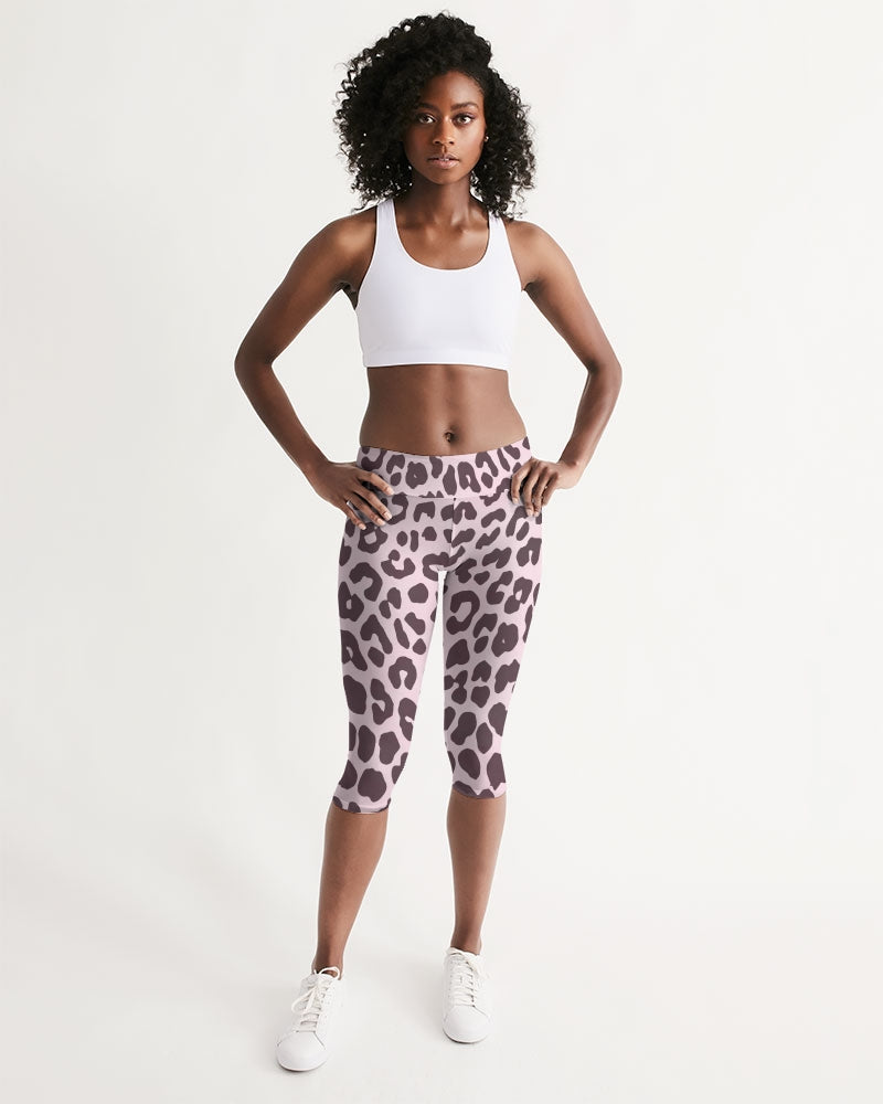 Women's Mid-rise Capri featuring a vibrant pink and black leopard print design, perfect for workouts and lounging.