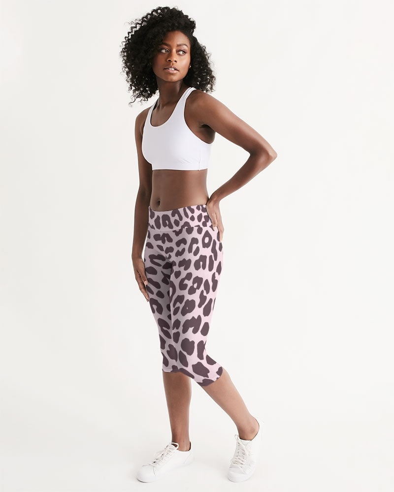 Women's Mid-rise Capri featuring a vibrant pink and black leopard print design, perfect for workouts and lounging.