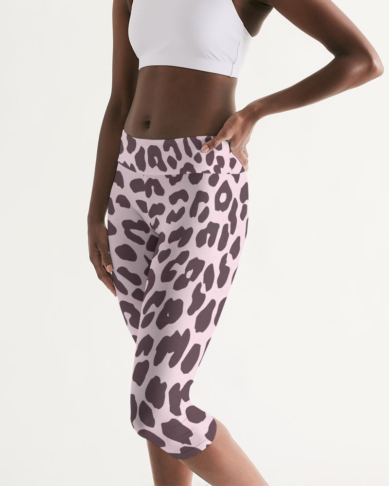 Women's Mid-rise Capri featuring a vibrant pink and black leopard print design, perfect for workouts and lounging.