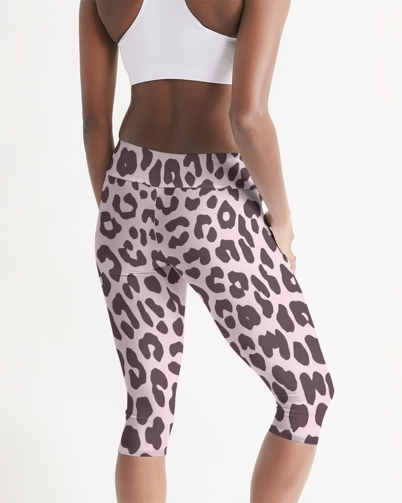 Women's Mid-rise Capri featuring a vibrant pink and black leopard print design, perfect for workouts and lounging.