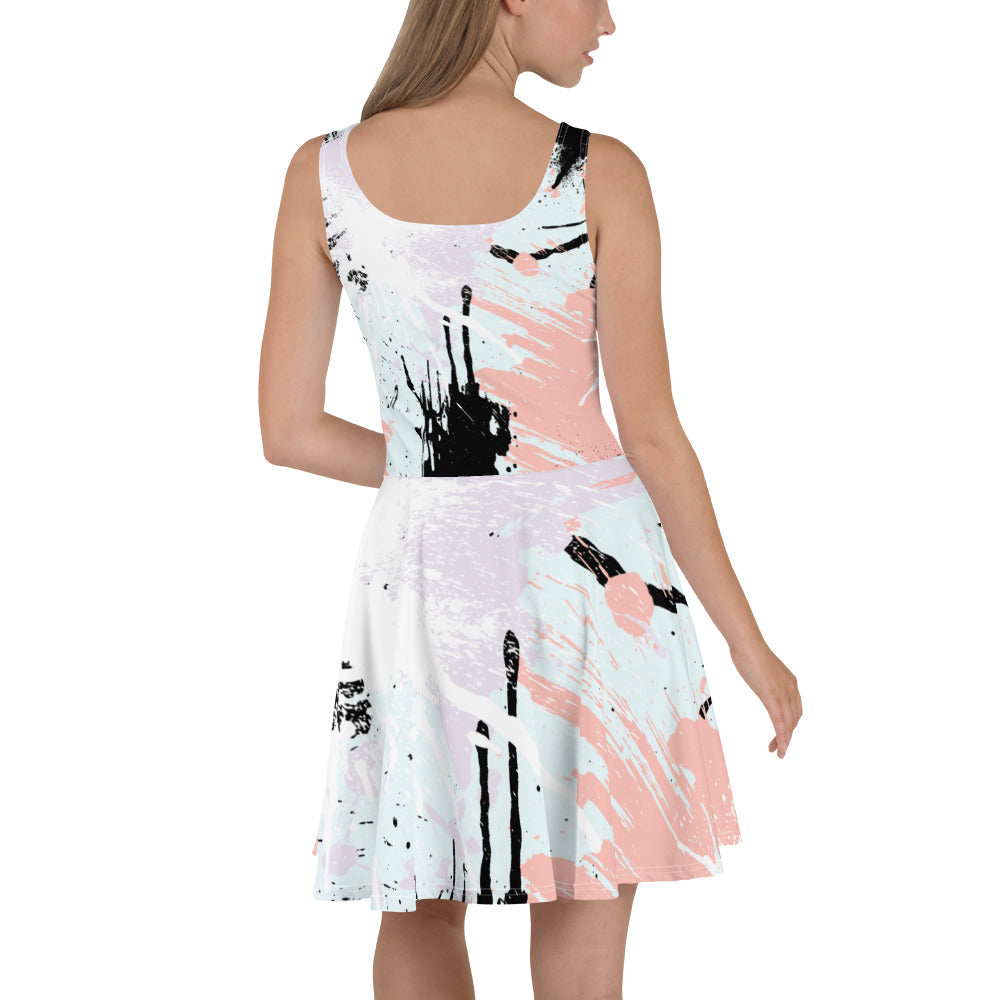 A stylish women's skater dress featuring a pink and black abstract print, showcasing a flattering A-line silhouette and sleeveless design.