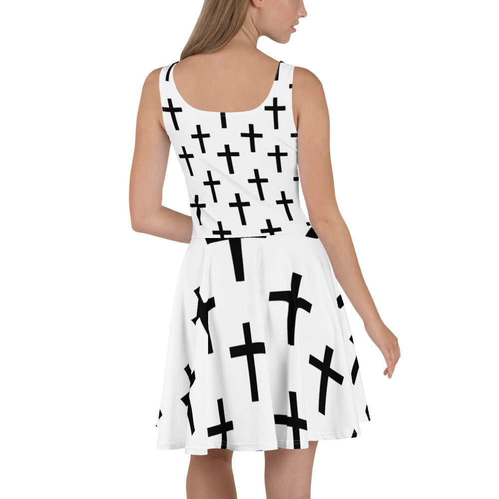 Women's skater dress featuring a stylish white and black cross print, showcasing a flattering A-line silhouette and sleeveless design.