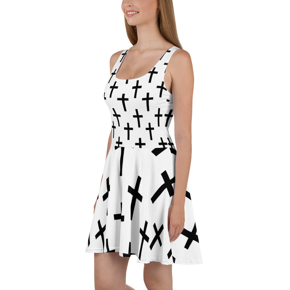 Women's skater dress featuring a stylish white and black cross print, showcasing a flattering A-line silhouette and sleeveless design.