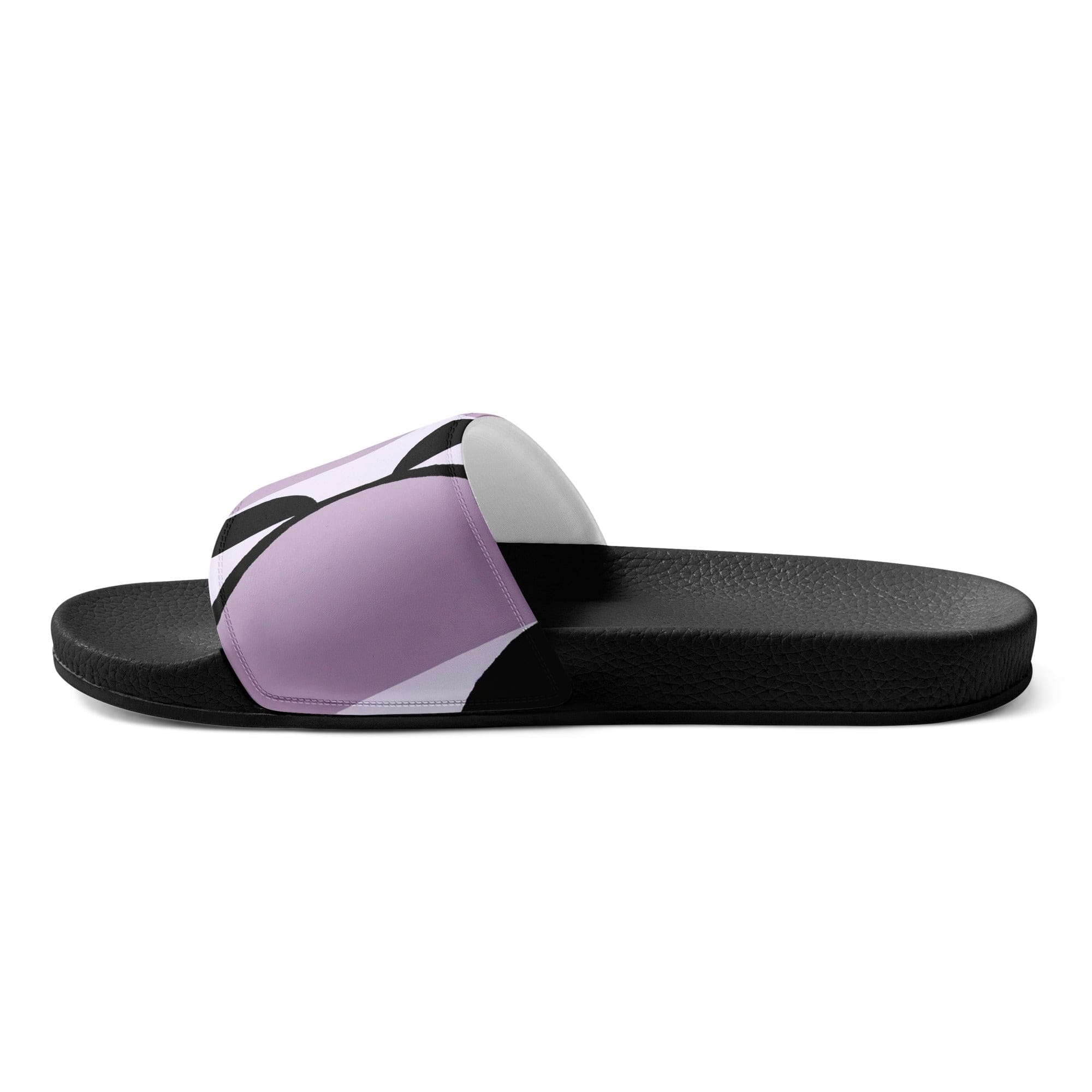 A pair of women's slides featuring a geometric lavender and black pattern, showcasing a cushioned upper strap and textured footbed.
