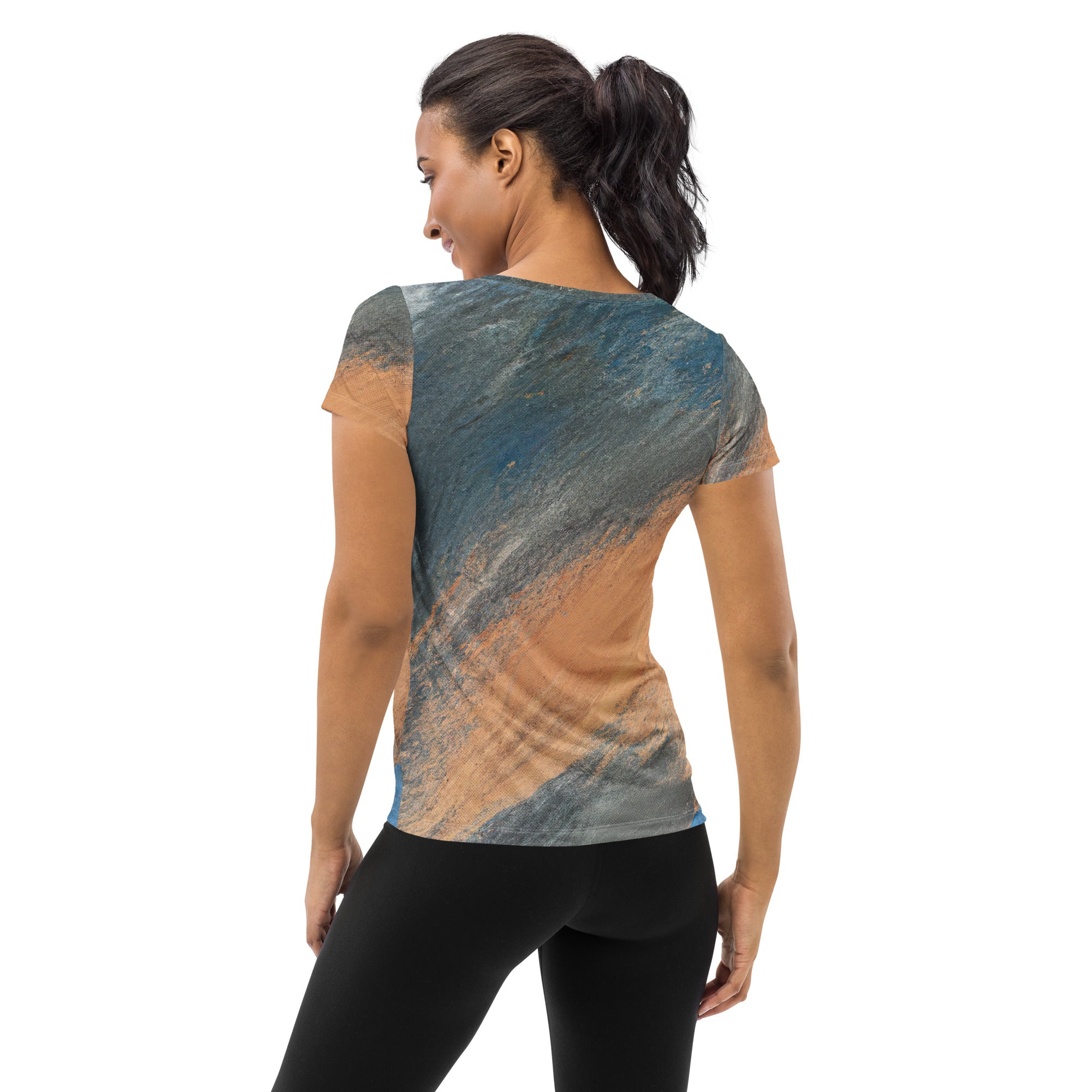 Women's Stretch Fit Athletic Sports T-shirt in blue and orange abstract pattern, showcasing its flexible fit and moisture-wicking fabric.