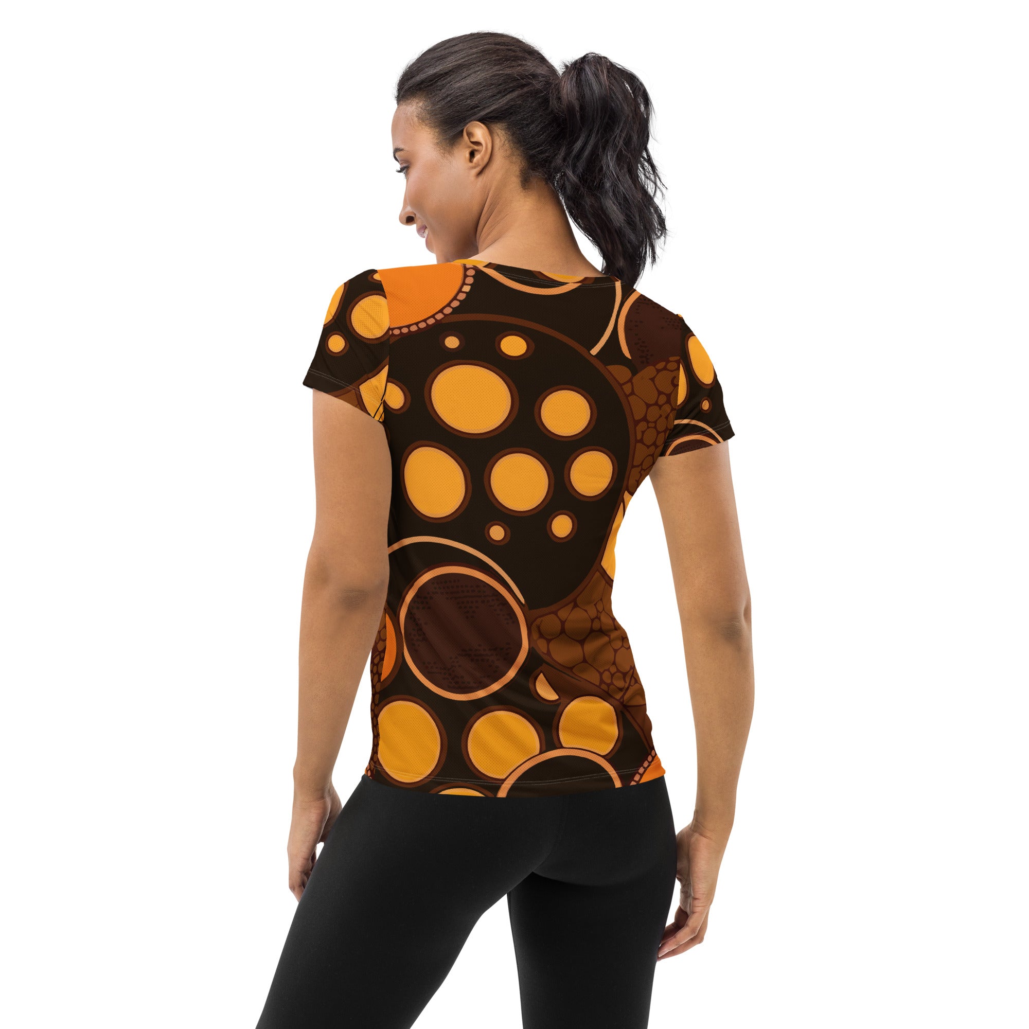 Women's Stretch Fit Athletic Sports T-shirt in orange and brown spotted print, showcasing its flexible fit and stylish design.